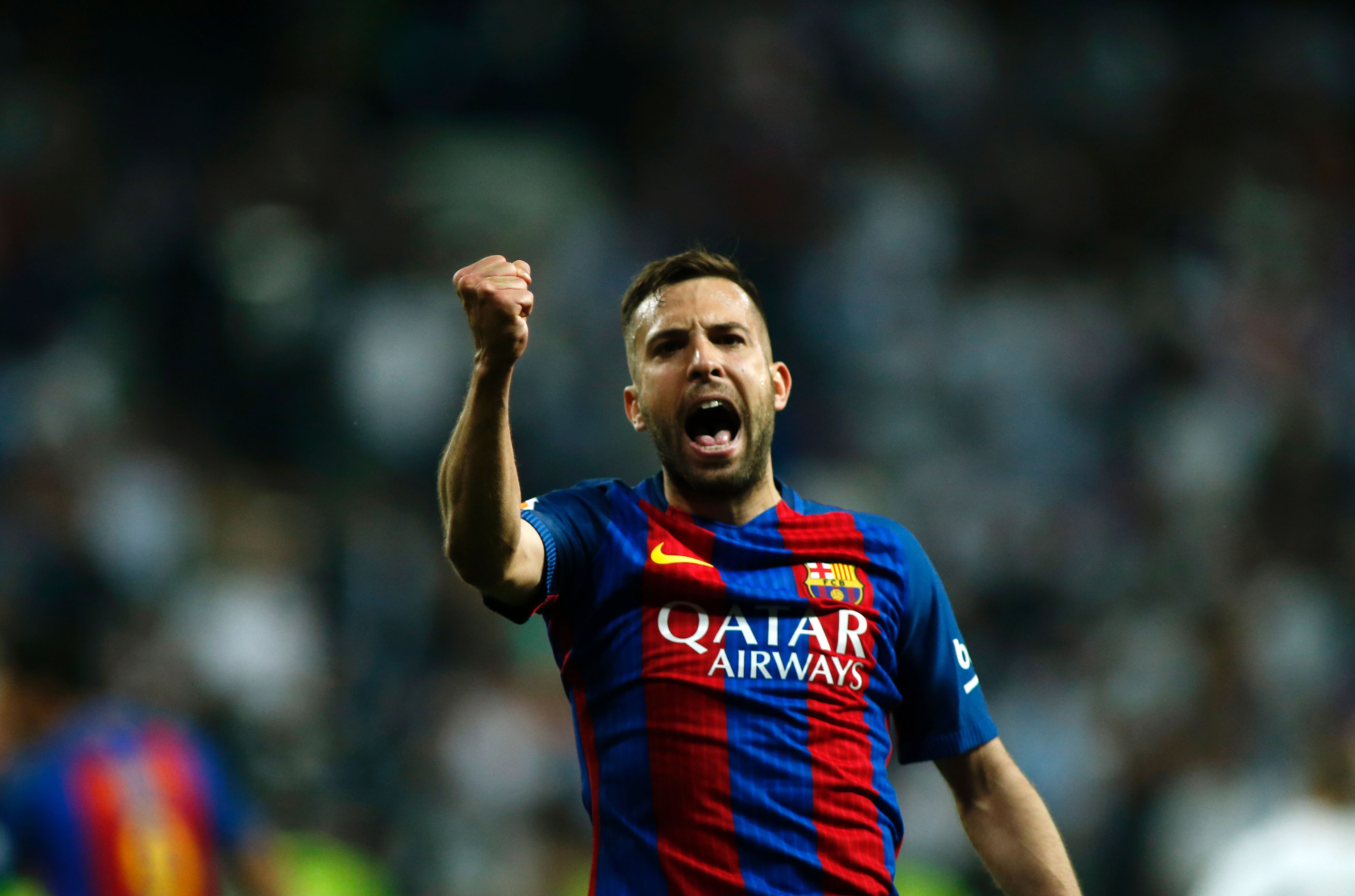 Barcelona's defender Jordi Alba gestures during the Spanish league Clasico football match Real Madrid CF vs FC Barcelona at the Santiago Bernabeu stadium in Madrid on April 23, 2017. / AFP PHOTO / OSCAR DEL POZO (Photo credit should read OSCAR DEL POZO/AFP/Getty Images)