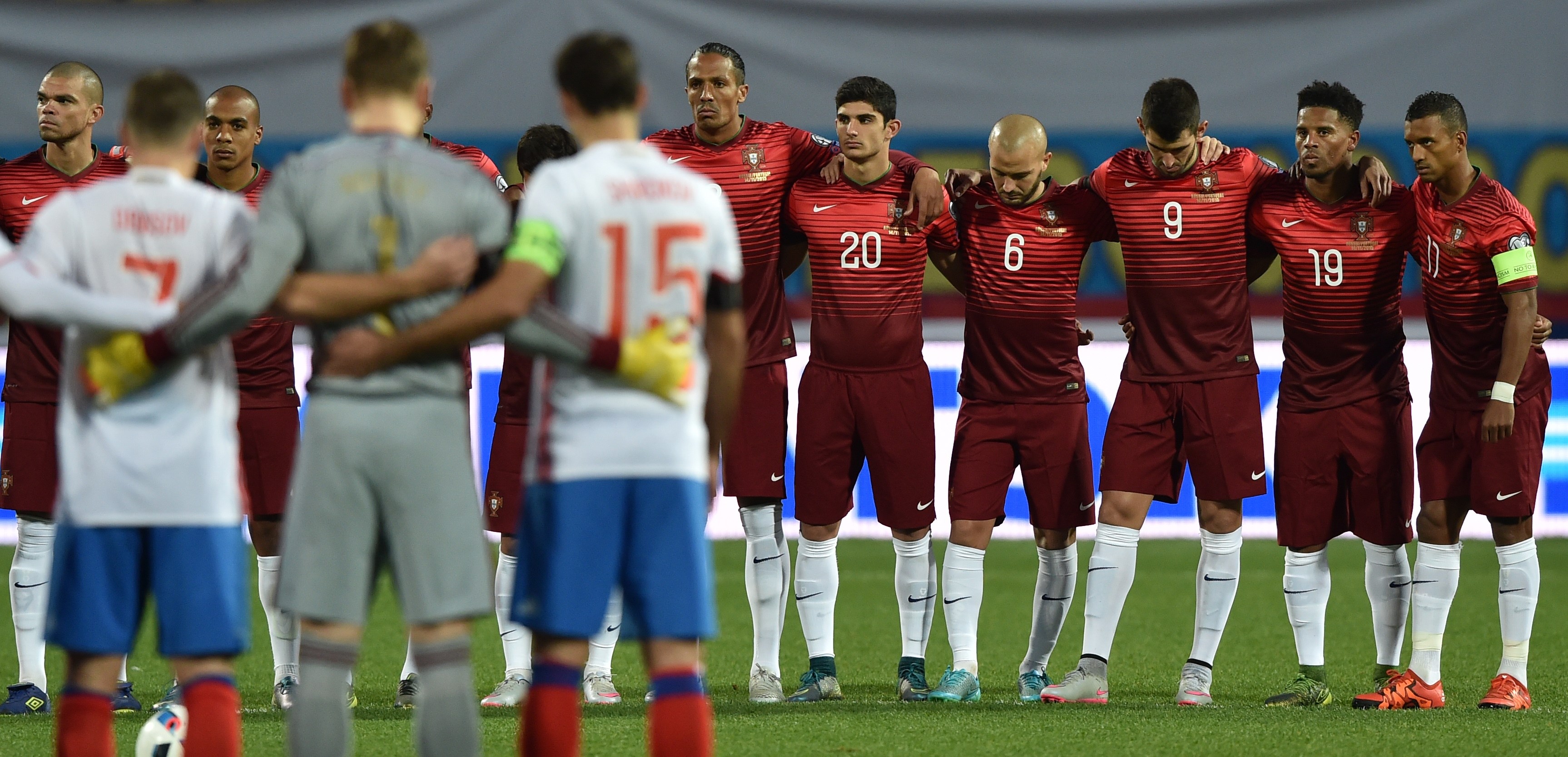 Russia's and Portugal's players observe a minute of silence in honor of victims of the attacks that left at least 120 dead in Paris, prior to the friendly football match between Russia and Portugal in Krasnodar on November 14, 2015. AFP PHOTO / KIRILL KUDRYAVTSEV (Photo credit should read KIRILL KUDRYAVTSEV/AFP/Getty Images)