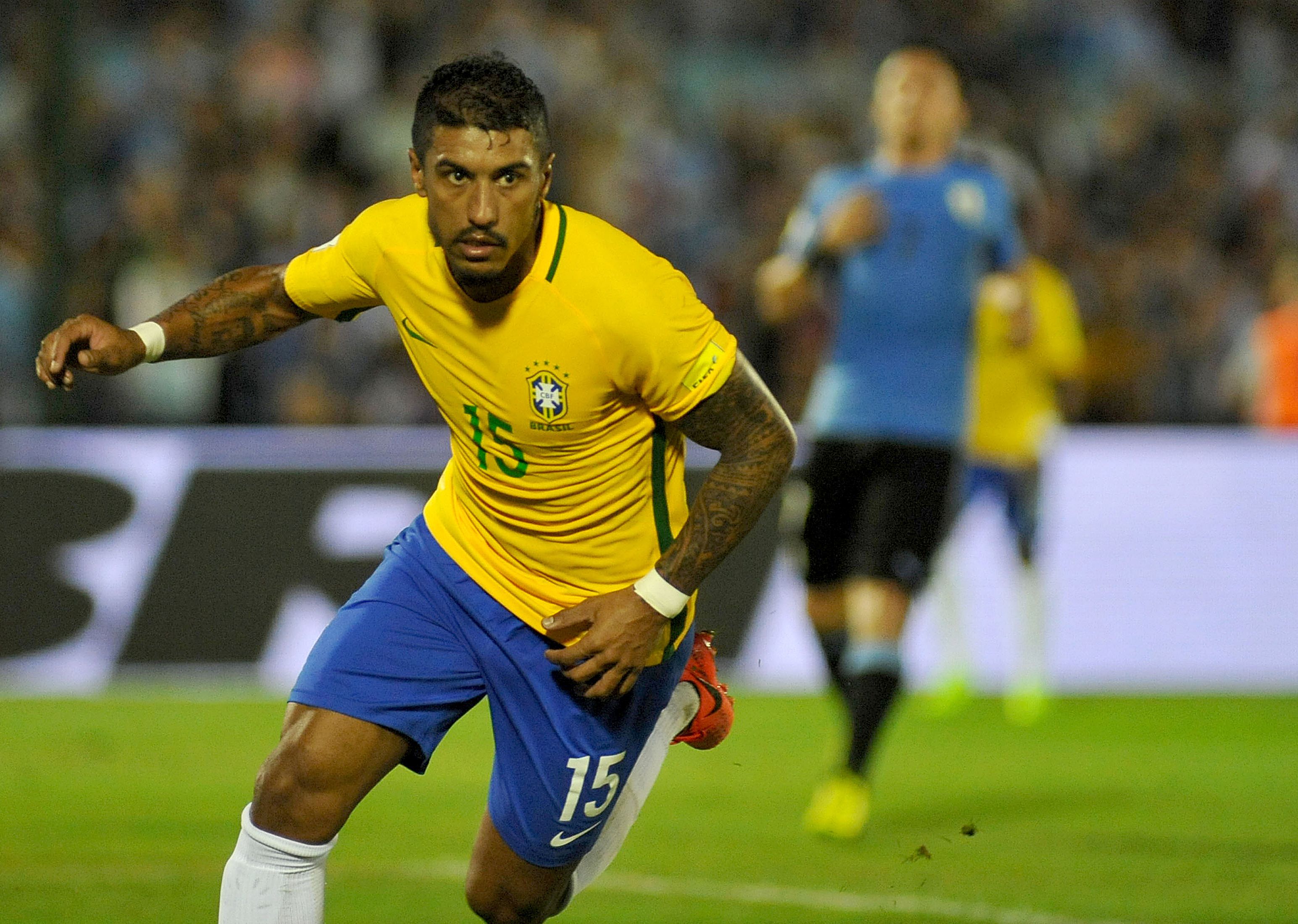 Brazil's midfieler Paulinho celebrates after scoring against Uruguay during their 2018 FIFA World Cup qualifier football match at the Centenario stadium in Montevideo, on March 23, 2017. / AFP PHOTO / DANTE FERNANDEZ (Photo credit should read DANTE FERNANDEZ/AFP/Getty Images)