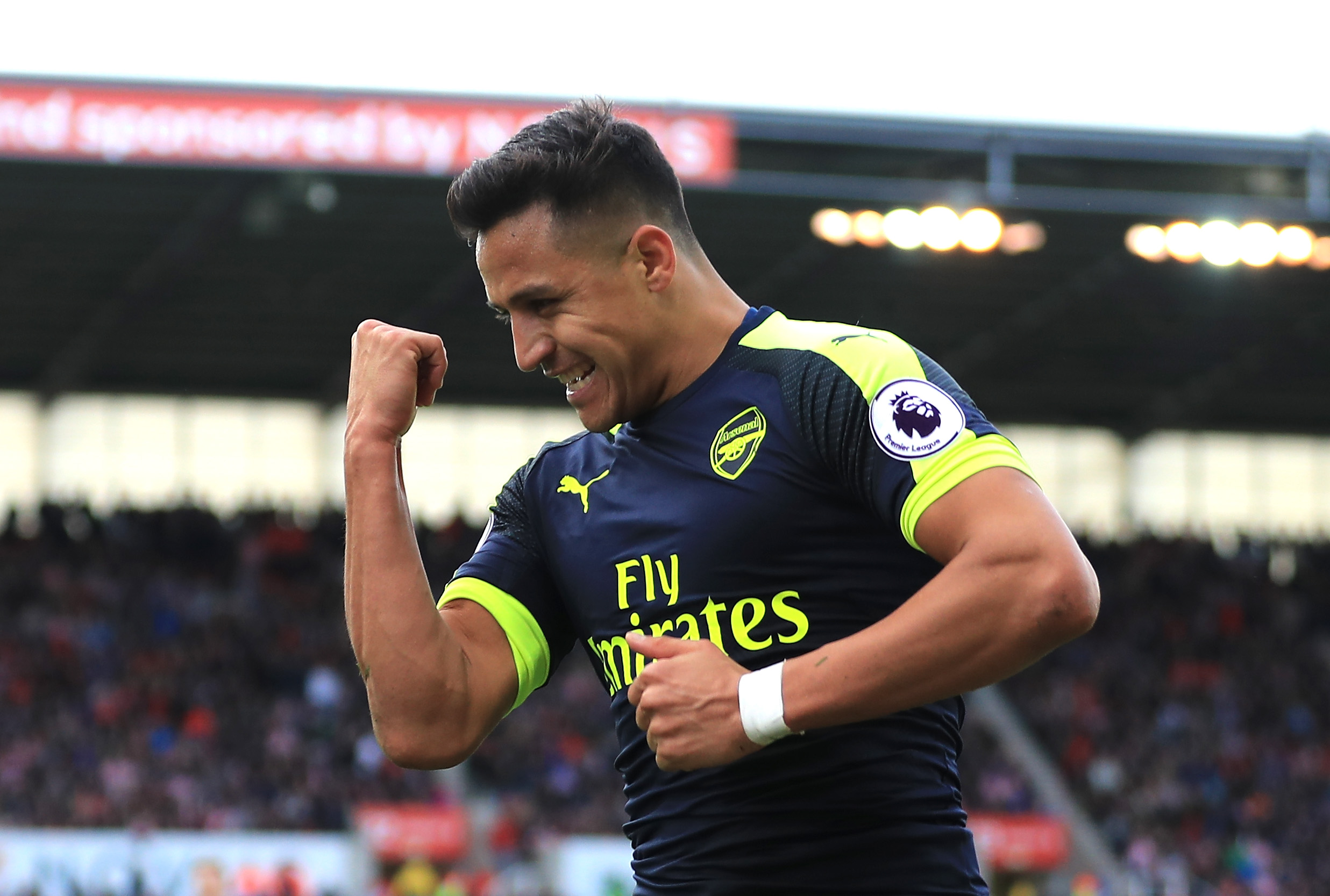 STOKE ON TRENT, ENGLAND - MAY 13: Alexis Sanchez of Arsenal celebrates scoring his sides third goal during the Premier League match between Stoke City and Arsenal at Bet365 Stadium on May 13, 2017 in Stoke on Trent, England. (Photo by Richard Heathcote/Getty Images)