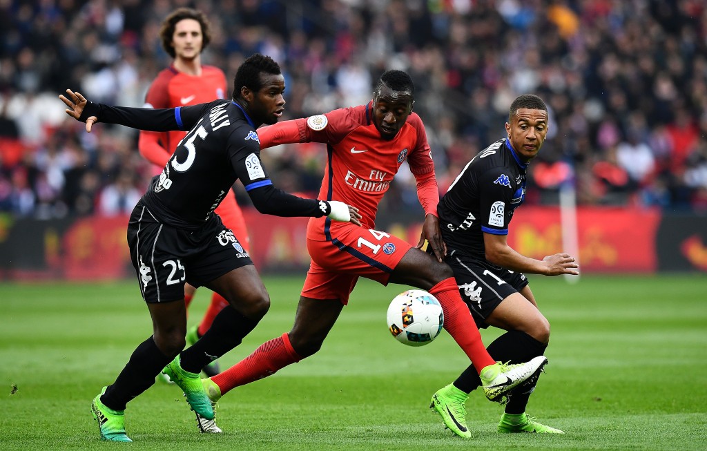 Paris Saint-Germain's French midfielder Blaise Matuidi (C) challenges Bastia's Malian midfielder Lassana Coulibaly (L) and Bastia's French midfielder Axel Ngando during the French L1 football match between Paris Saint-Germain and Bastia at the Parc des Princes stadium in Paris on May 6, 2017. / AFP PHOTO / FRANCK FIFE (Photo credit should read FRANCK FIFE/AFP/Getty Images)