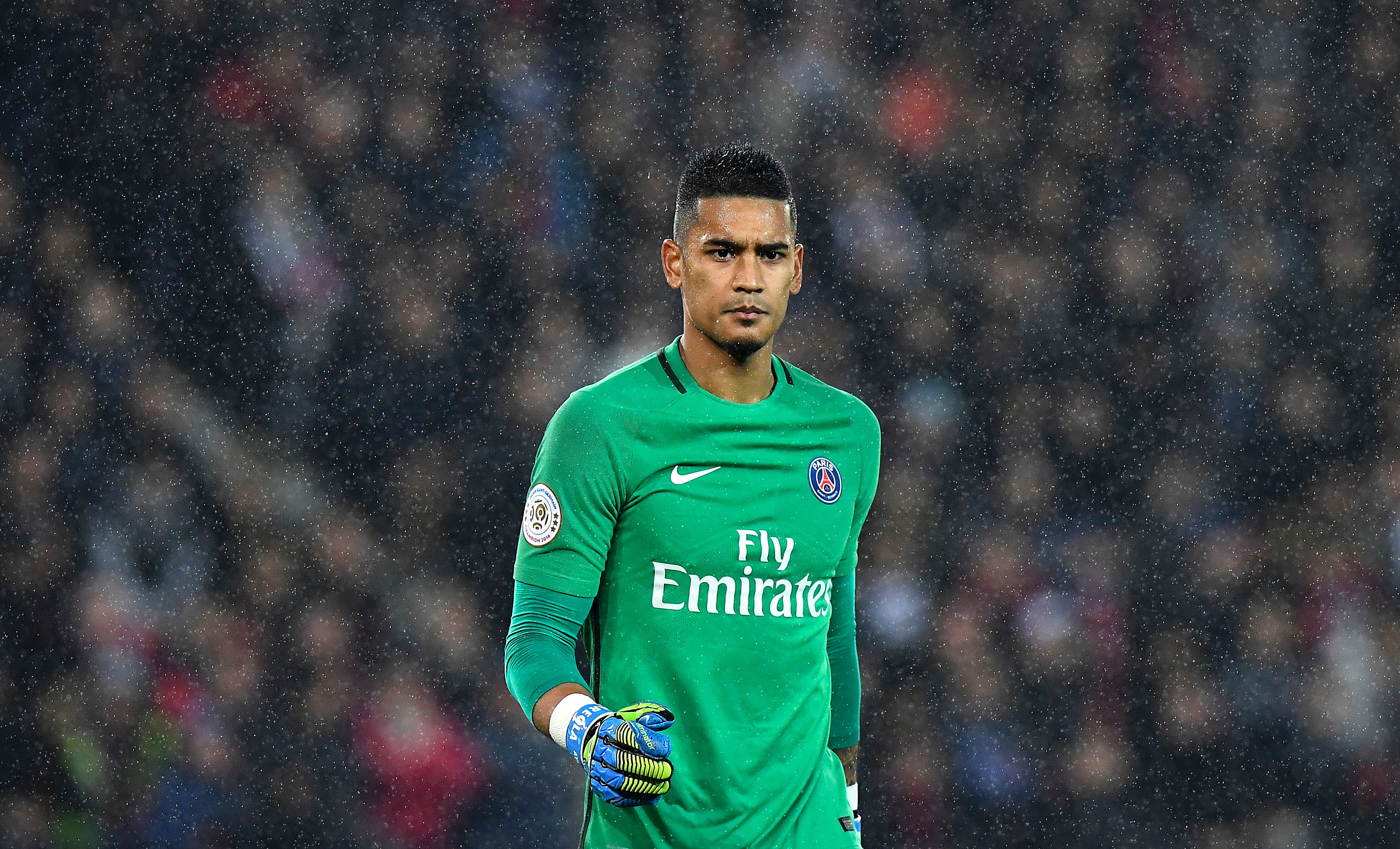 Paris Saint-Germain's French goalkeeper Alphonse Areola walks in the rain during the French L1 football match between Paris Saint-Germain and Olympique of Marseille at the Parc des Princes stadium in Paris on October 23, 2016. / AFP / FRANCK FIFE (Photo credit should read FRANCK FIFE/AFP/Getty Images)