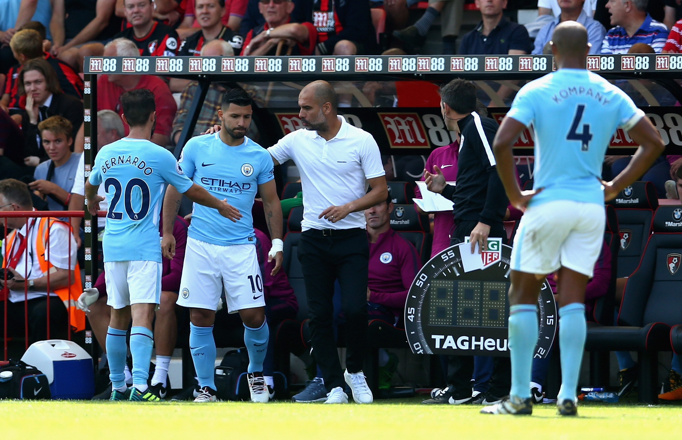 BOURNEMOUTH, ENGLAND - AUGUST 26: Josep Guardiola, Manager of Manchester City gives instructions to Sergio Aguero of Manchester City as he prepares to come on during the Premier League match between AFC Bournemouth and Manchester City at Vitality Stadium on August 26, 2017 in Bournemouth, England. (Photo by Steve Bardens/Getty Images)