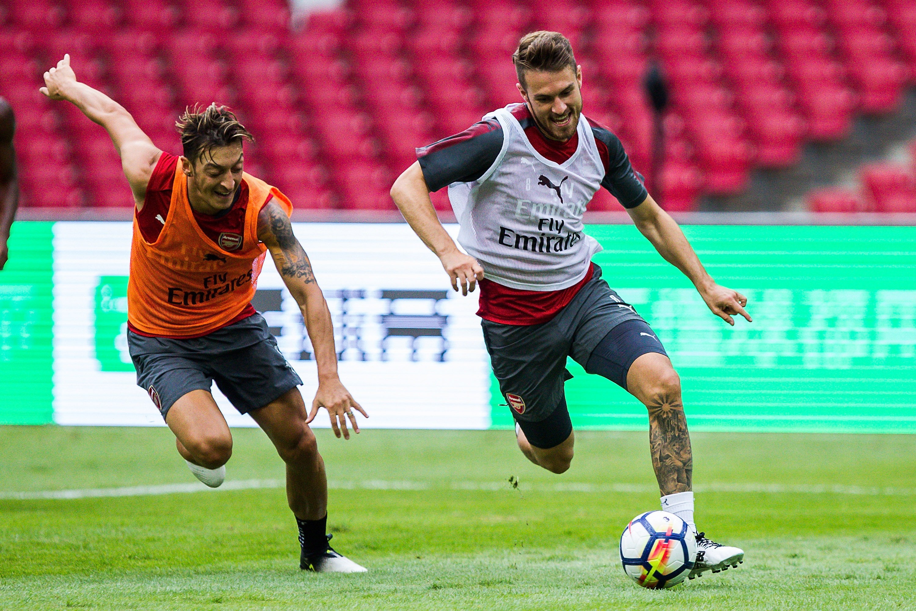 BEIJING, CHINA - JULY 21: Mesut Ozil and Aaron Ramsey fight for the ball during a training session at Birds Nest on July 21, 2017 in Beijing, China. (Photo by Yifan Ding/Getty Images)