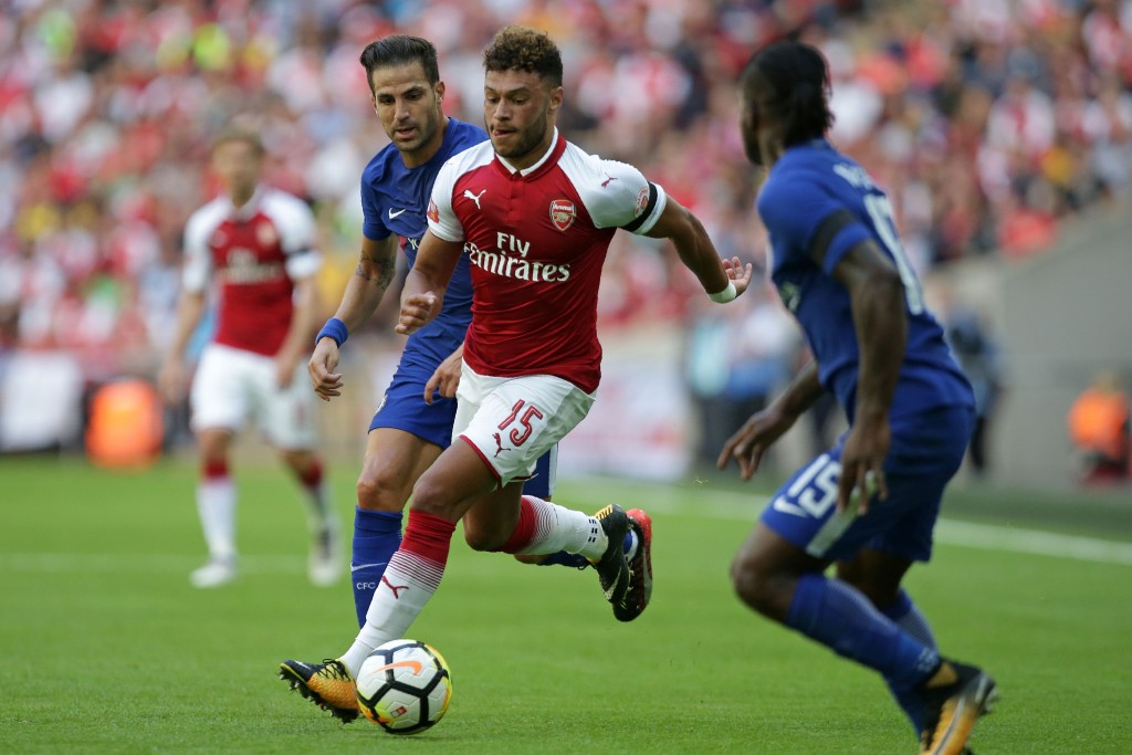 Arsenal's English midfielder Alex Oxlade-Chamberlain vies with Chelsea's Spanish midfielder Cesc Fabregas (L) during the English FA Community Shield football match between Arsenal and Chelsea at Wembley Stadium in north London on August 6, 2017. / AFP PHOTO / Daniel LEAL-OLIVAS / NOT FOR MARKETING OR ADVERTISING USE / RESTRICTED TO EDITORIAL USE (Photo credit should read DANIEL LEAL-OLIVAS/AFP/Getty Images)