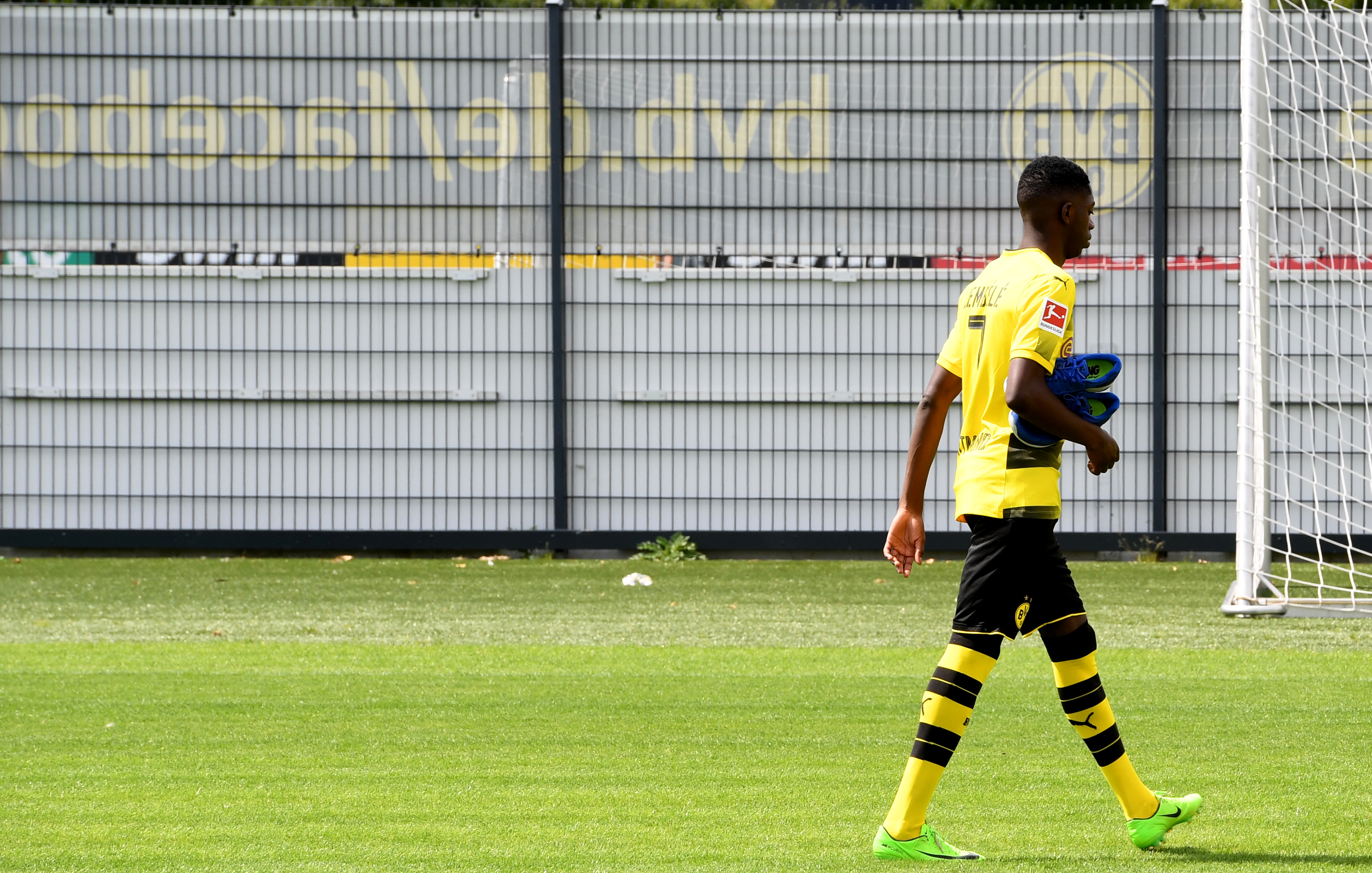 Dortmund's French midfielder Ousmane Dembele walks over the pitch during a press event of German first division Bundesliga football club Borussia Dortmund on August 9, 2017 in Dortmund, western Germany. / AFP PHOTO / PATRIK STOLLARZ (Photo credit should read PATRIK STOLLARZ/AFP/Getty Images)