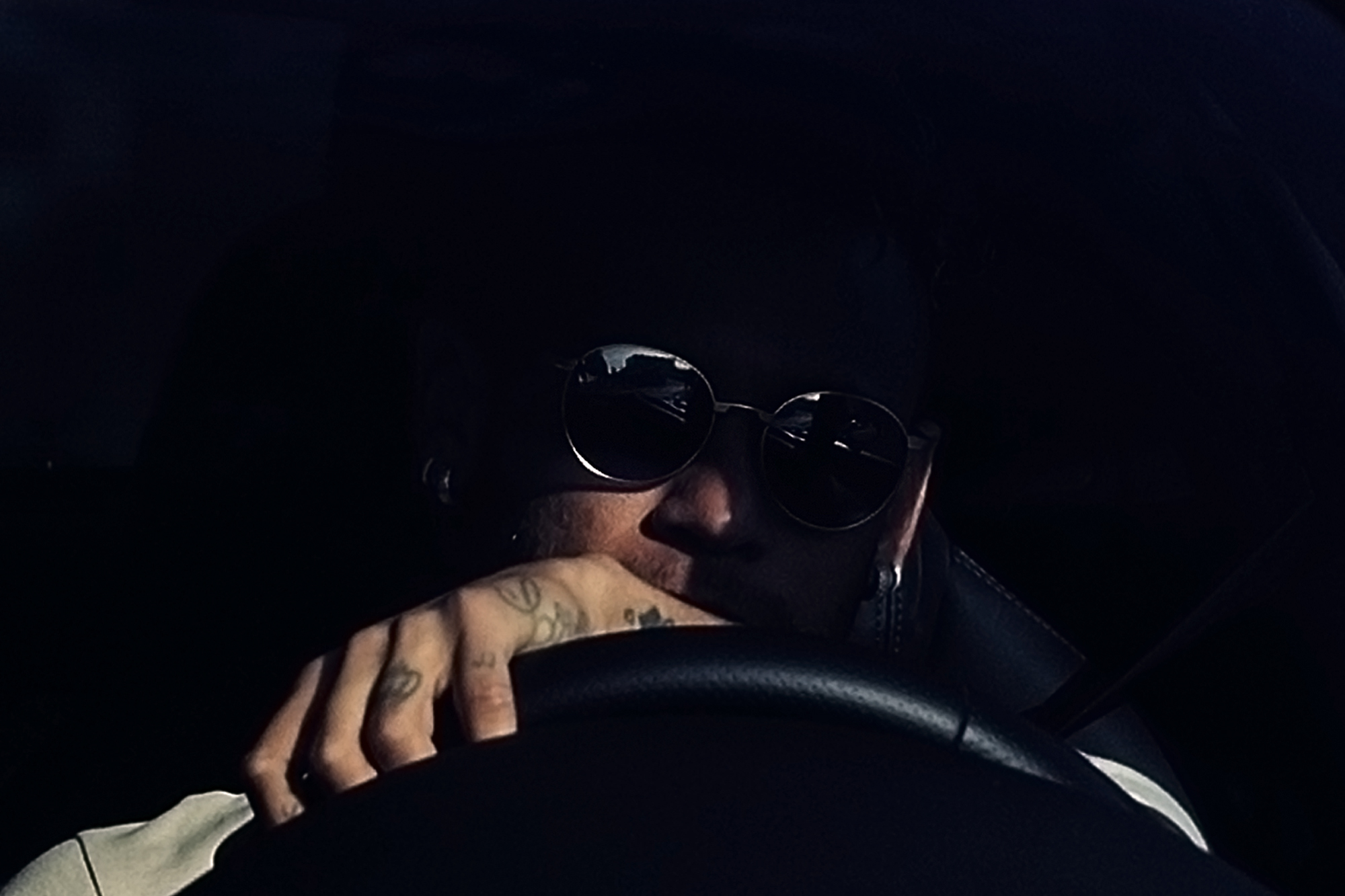 Barcelona's Brazilian forward Neymar drives into the parkinglot to take part in a training session at the Sports Center FC Barcelona Joan Gamper in Sant Joan Despi, near Barcelona on August 2, 2017 following rumour that he is considering a move to French club PSG for which the club would have to shell out some 222 million euros, enough to trigger the 25-year-old's transfer release clause.


 / AFP PHOTO / Josep LAGO        (Photo credit should read JOSEP LAGO/AFP/Getty Images)