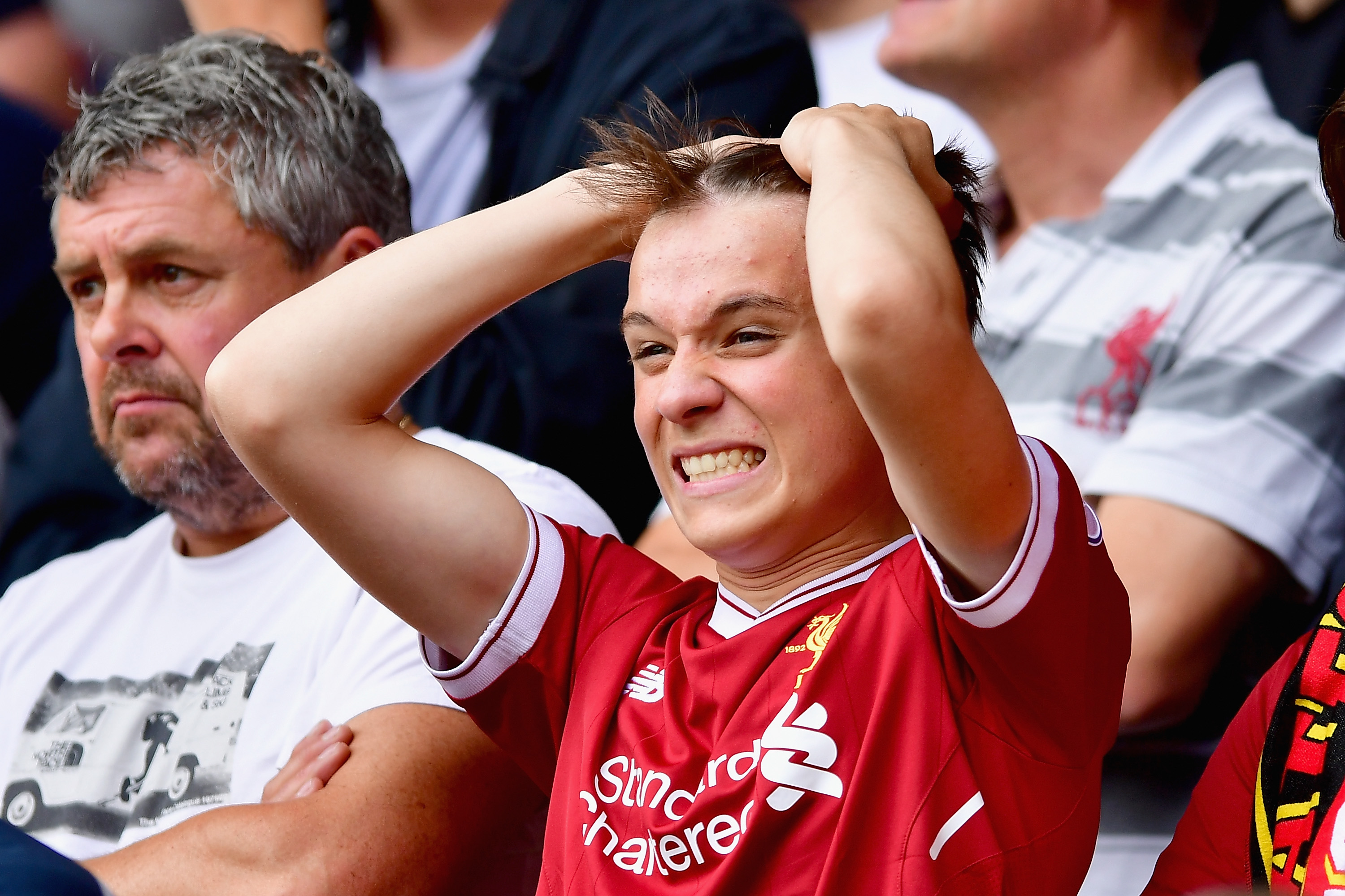 WATFORD, ENGLAND - AUGUST 12: A Liverpool fan reacts during the Premier League match between Watford and Liverpool at Vicarage Road on August 12, 2017 in Watford, England.  (Photo by Alex Broadway/Getty Images)