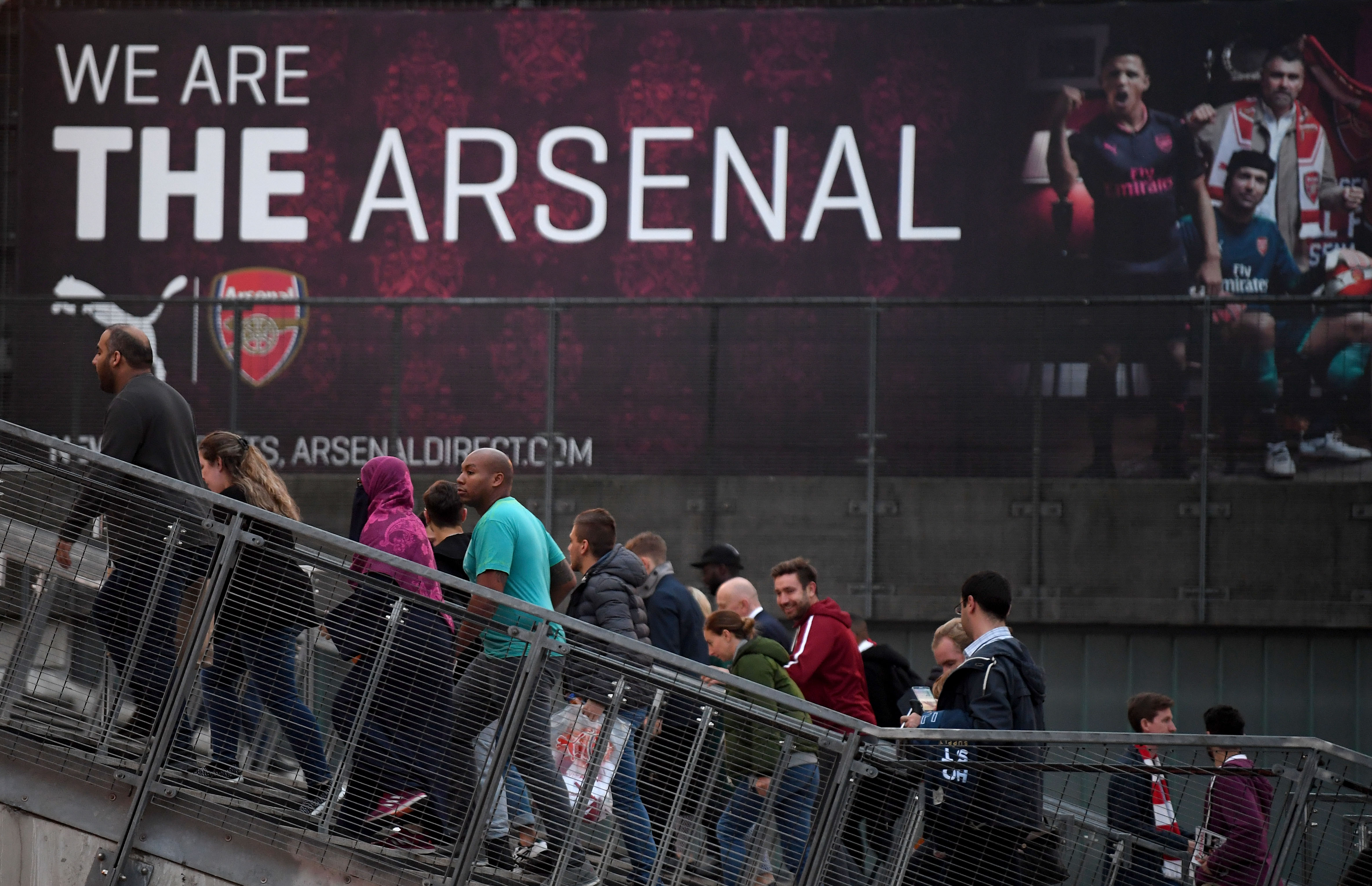 LONDON, ENGLAND - SEPTEMBER 25: Fans walk outside the stadium prior to the Premier League match between Arsenal and West Bromwich Albion at Emirates Stadium on September 25, 2017 in London, England. (Photo by Mike Hewitt/Getty Images)
