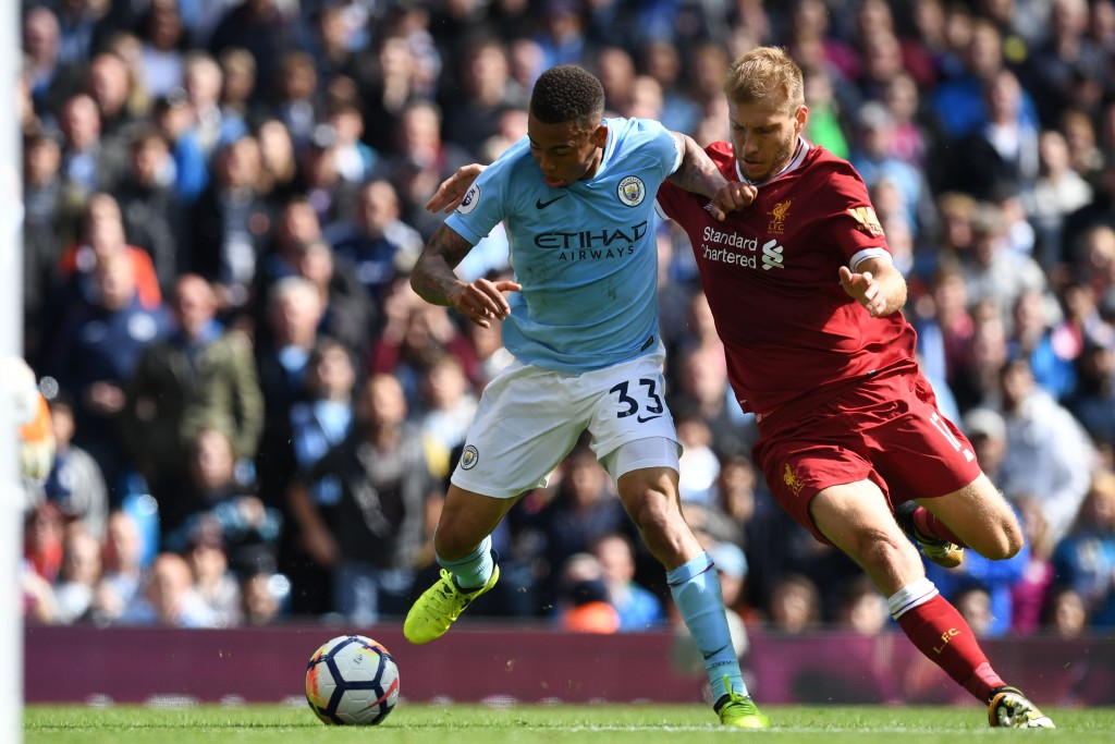 Manchester City's Brazilian striker Gabriel Jesus (L) vies with Liverpool's Estonian defender Ragnar Klavan during the English Premier League football match between Manchester City and Liverpool at the Etihad Stadium in Manchester, north west England, on September 9, 2017. / AFP PHOTO / Paul ELLIS / RESTRICTED TO EDITORIAL USE. No use with unauthorized audio, video, data, fixture lists, club/league logos or 'live' services. Online in-match use limited to 75 images, no video emulation. No use in betting, games or single club/league/player publications. / (Photo credit should read PAUL ELLIS/AFP/Getty Images)