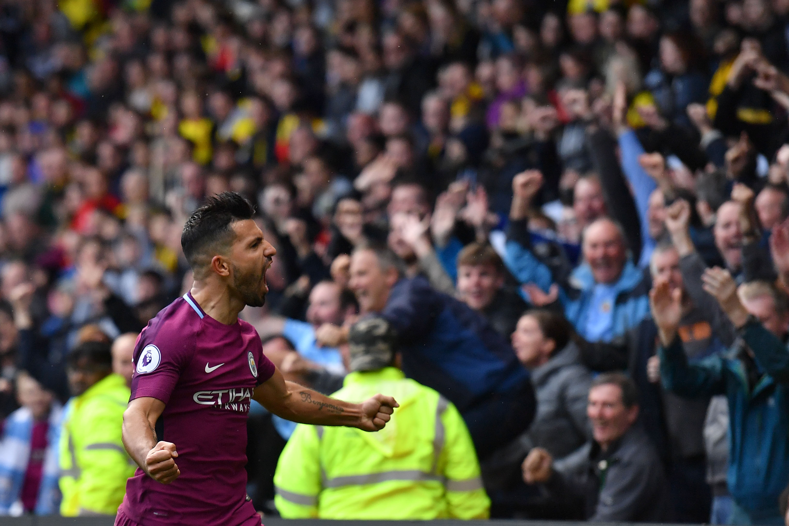 Manchester City's Argentinian striker Sergio Aguero celebrates scoring  his third and the team's fifth goal during the English Premier League football match between Watford and Manchester City at Vicarage Road Stadium in Watford, north of London on September 16, 2017. / AFP PHOTO / Ben STANSALL / RESTRICTED TO EDITORIAL USE. No use with unauthorized audio, video, data, fixture lists, club/league logos or 'live' services. Online in-match use limited to 75 images, no video emulation. No use in betting, games or single club/league/player publications.  /         (Photo credit should read BEN STANSALL/AFP/Getty Images)