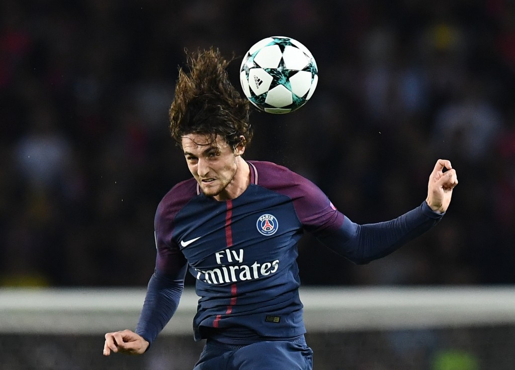 Paris Saint-Germain's French midfielder Adrien Rabiot heads the ball during the UEFA Champions League football match between Paris Saint-Germain and Bayern Munich on September 27, 2017 at the Parc des Princes stadium in Paris. / AFP PHOTO / FRANCK FIFE (Photo credit should read FRANCK FIFE/AFP/Getty Images)