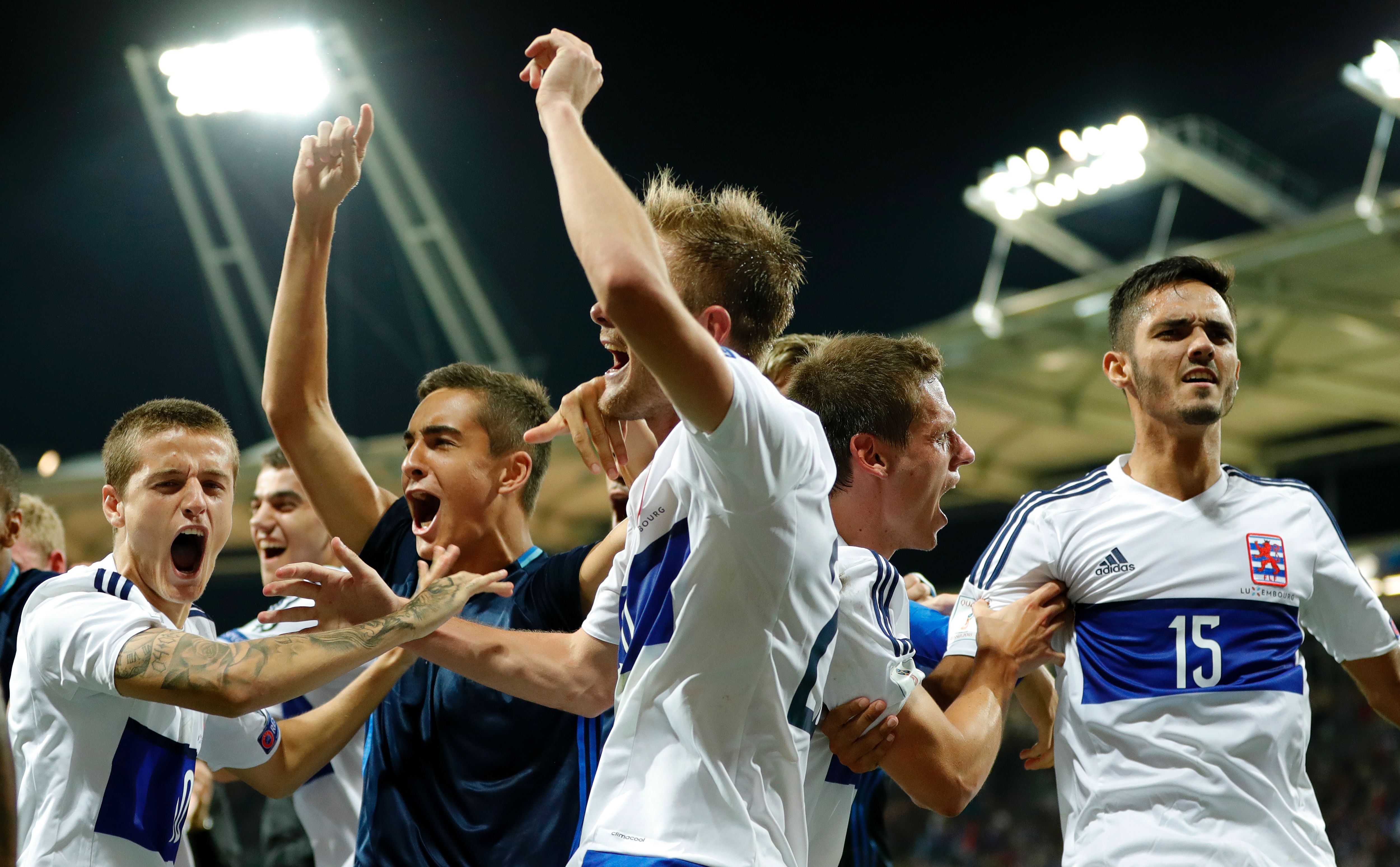 Luxembourg's players celebrate at the end of the FIFA World Cup 2018 qualifying football match France vs Luxembourg at The Municipal Stadium in Toulouse, southern France, on September 3, 2017.  / AFP PHOTO / FRANCK FIFE        (Photo credit should read FRANCK FIFE/AFP/Getty Images)