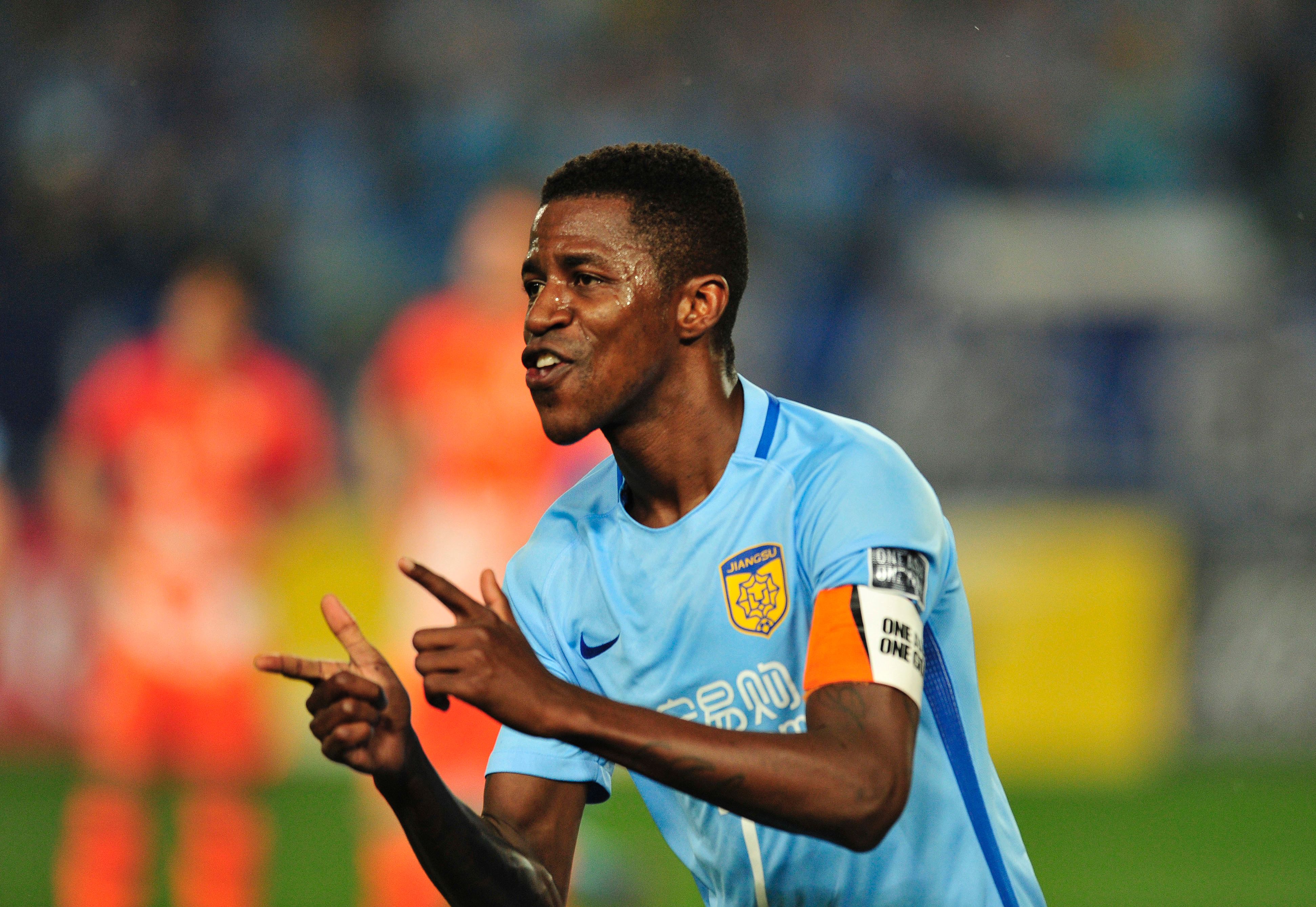 Ramires Santos of Jiangsu FC celebrates after scoring a goal during the AFC Champions League group stage football match against Jeju United FC in Nanjing, east China's Jiangsu province, on April 25, 2017. / AFP PHOTO / STR (Photo credit should read STR/AFP/Getty Images)