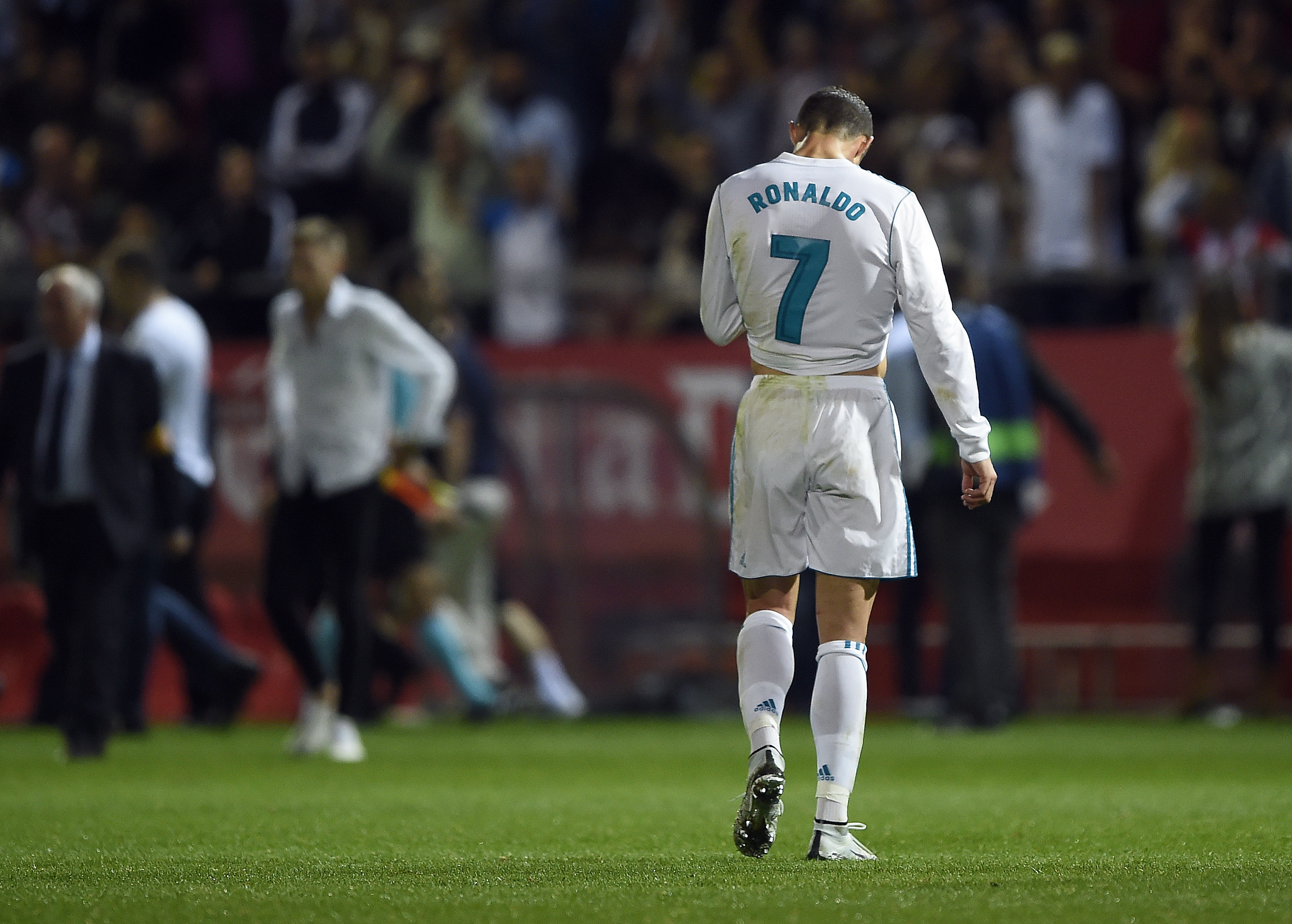 Real Madrid's Portuguese forward Cristiano Ronaldo walks on the field after a goal by Girona during the Spanish league football match Girona FC vs Real Madrid CF at the Montilivi stadium in Girona on October 29, 2017. / AFP PHOTO / Josep LAGO (Photo credit should read JOSEP LAGO/AFP/Getty Images)