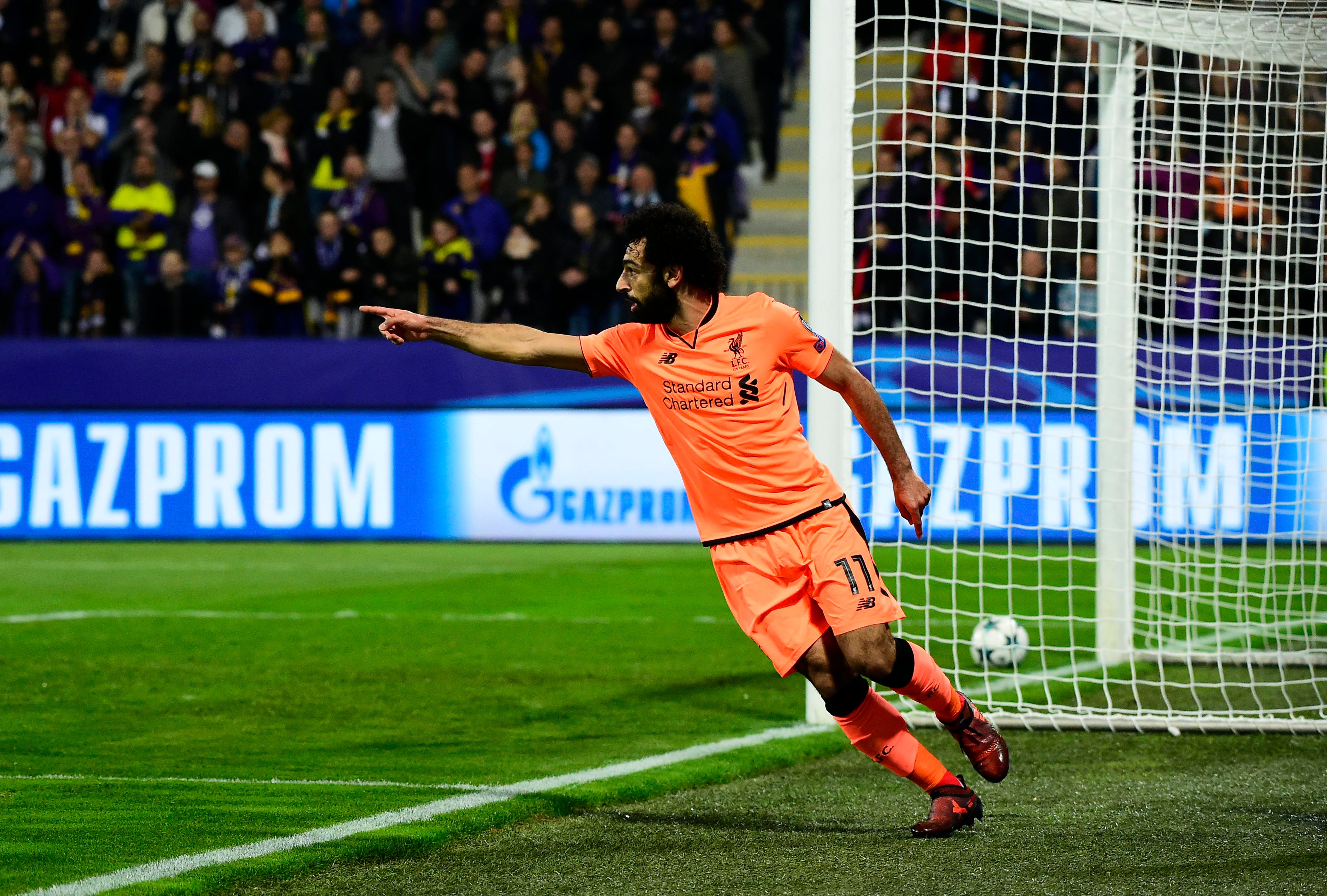 Liverpool's Egyptian forward Mohamed Salah celebrates after scoring a goal during the UEFA Champions League group E football match between NK Maribor and Liverpool at the Ljudski vrt Stadium, in Maribor, on October 17, 2017. / AFP PHOTO / Jure Makovec        (Photo credit should read JURE MAKOVEC/AFP/Getty Images)