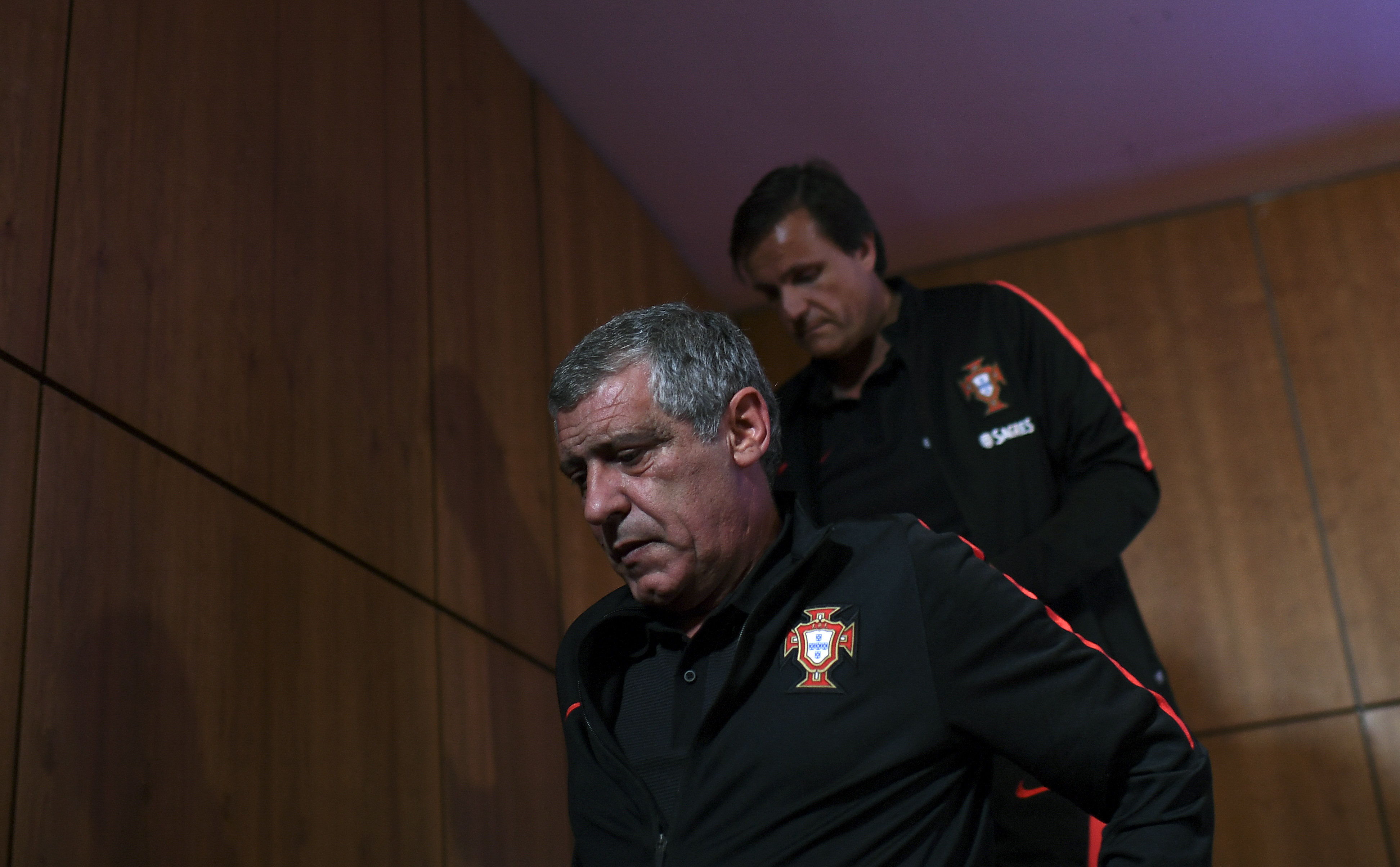 Portugal's coach Fernando Santos (L) leaves after giving a press conference at Bessa stadium in Porto on August 30, 2017, on the eve of the FIFA World Cup 2018 qualification football match between Portugal and Faroe Islands. / AFP PHOTO / FRANCISCO LEONG (Photo credit should read FRANCISCO LEONG/AFP/Getty Images)