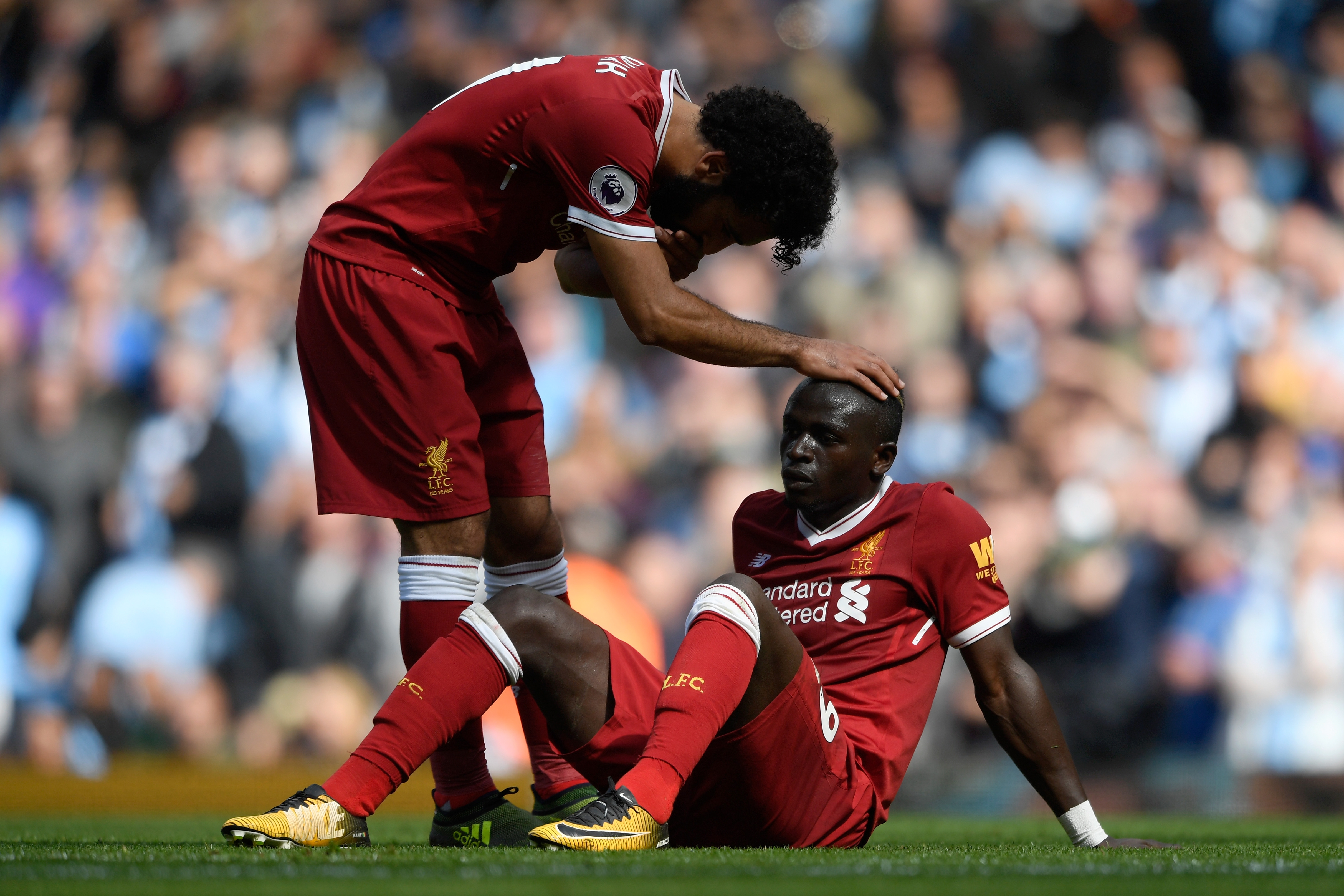 MANCHESTER, ENGLAND - SEPTEMBER 09:  Mohamed Salah of Liverpool comforts Sadio Mane of Liverpool after he reacts to being sent off during the Premier League match between Manchester City and Liverpool at Etihad Stadium on September 9, 2017 in Manchester, England.  (Photo by Stu Forster/Getty Images)