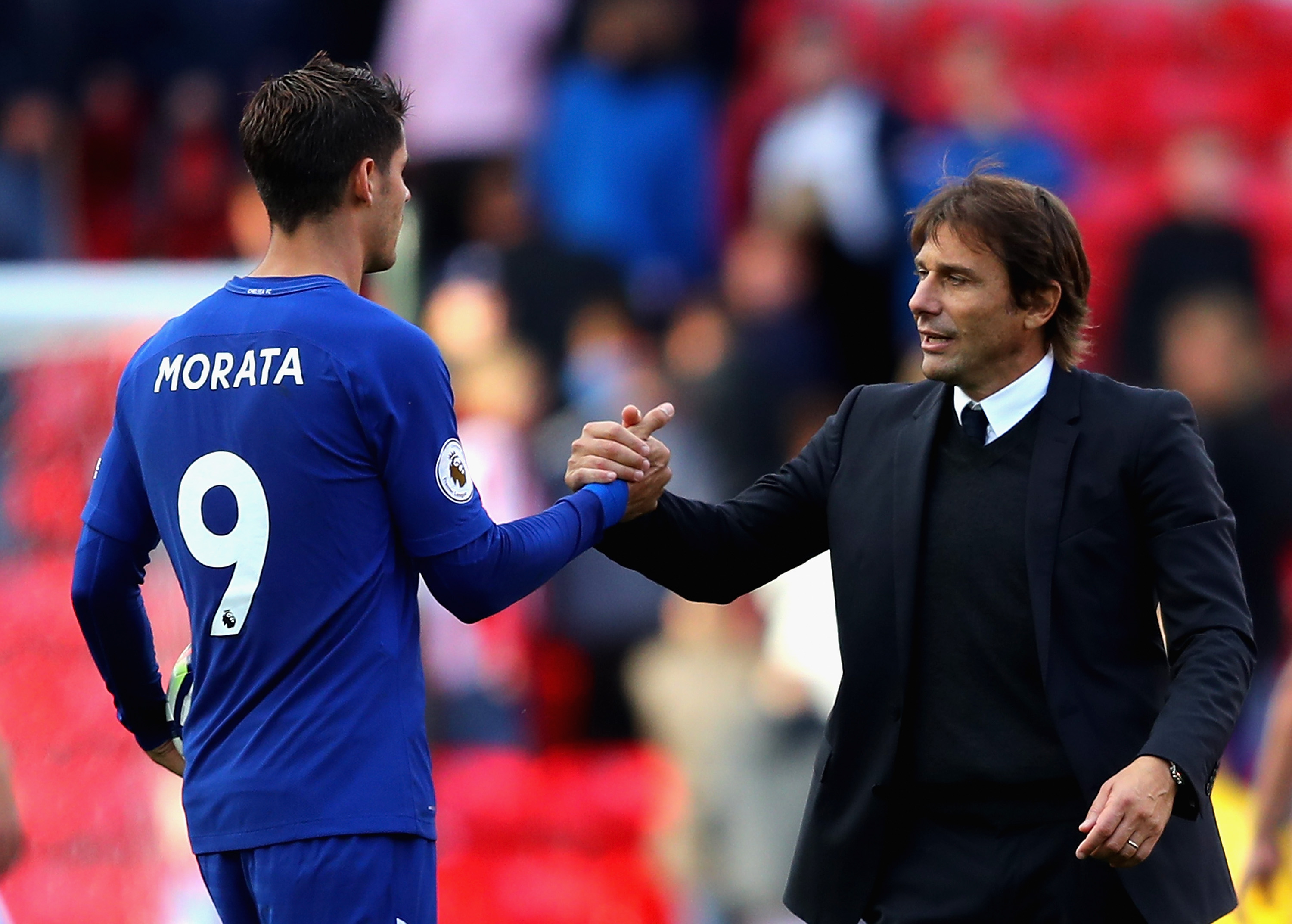 STOKE ON TRENT, ENGLAND - SEPTEMBER 23: Alvaro Morata of Chelsea is congratulated his team's 4-0 victory and his hat trick by manager Antonio Conte after the Premier League match between Stoke City and Chelsea at Bet365 Stadium on September 23, 2017 in Stoke on Trent, England. (Photo by Richard Heathcote/Getty Images)
