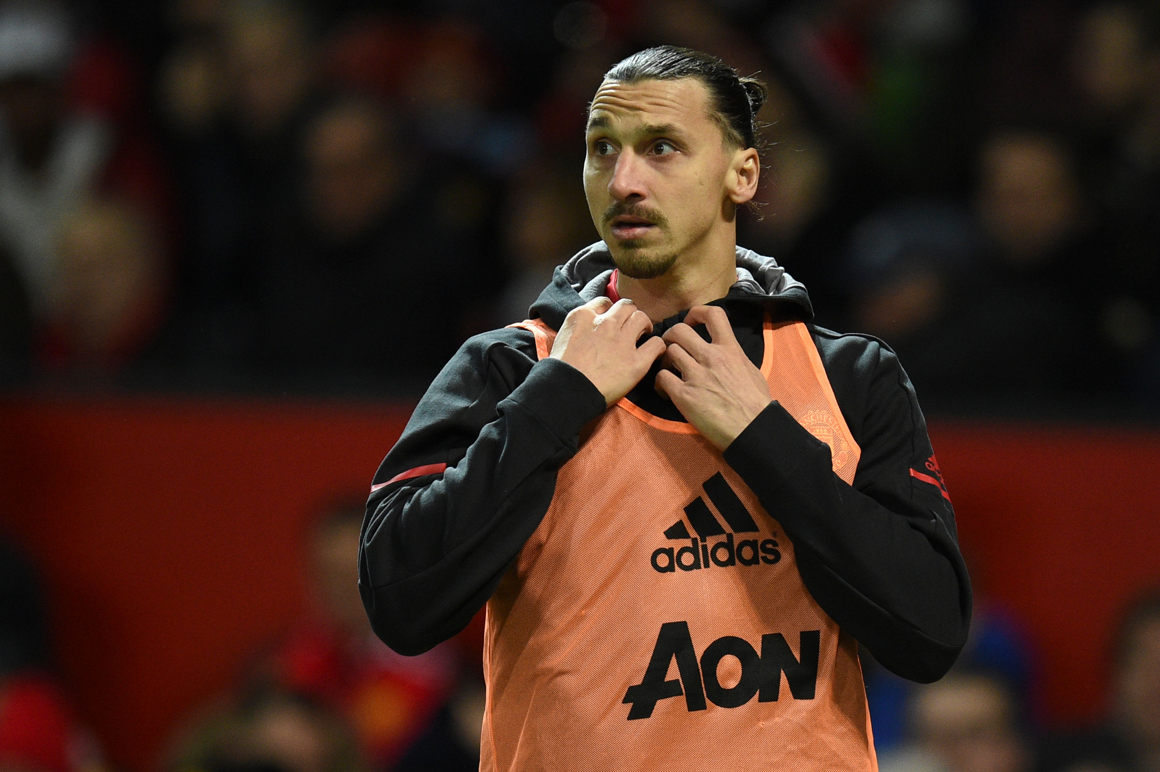 Manchester United's Swedish striker Zlatan Ibrahimovic warms up on the touchline during the English Premier League football match between Manchester United and Newcastle at Old Trafford in Manchester, north west England, on November 18, 2017. / AFP PHOTO / Oli SCARFF / RESTRICTED TO EDITORIAL USE. No use with unauthorized audio, video, data, fixture lists, club/league logos or 'live' services. Online in-match use limited to 75 images, no video emulation. No use in betting, games or single club/league/player publications. / (Photo credit should read OLI SCARFF/AFP/Getty Images)