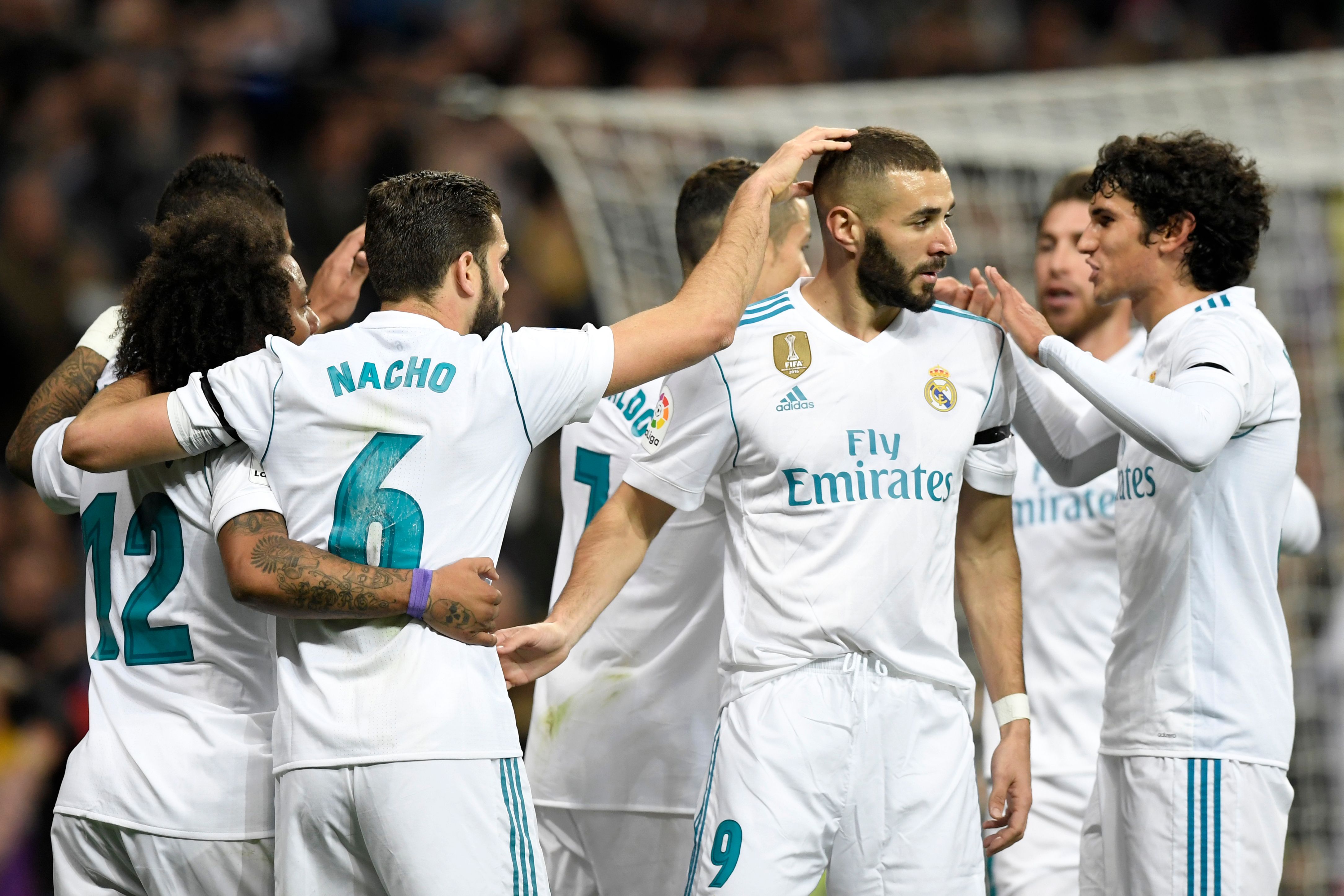 Real Madrid's players celebrate a goal during the Spanish league football match Real Madrid CF vs UD Las Palmas at the Santiago Bernabeu stadium in Madrid on November 5, 2017. / AFP PHOTO / GABRIEL BOUYS (Photo credit should read GABRIEL BOUYS/AFP/Getty Images)