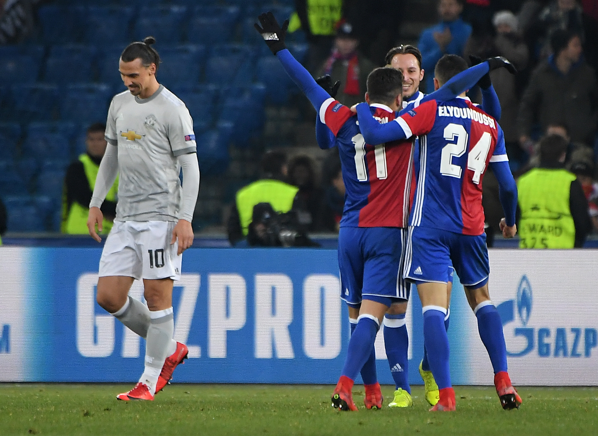 Basel's players celebrate as Manchester United's Swedish forward Zlatan Ibrahimovic reacts the UEFA Champions League Group A football match between FC Basel and Manchester United at Saint Jakob-Park Stadium on November 22, 2017 in Basel. / AFP PHOTO / PATRICK HERTZOG        (Photo credit should read PATRICK HERTZOG/AFP/Getty Images)