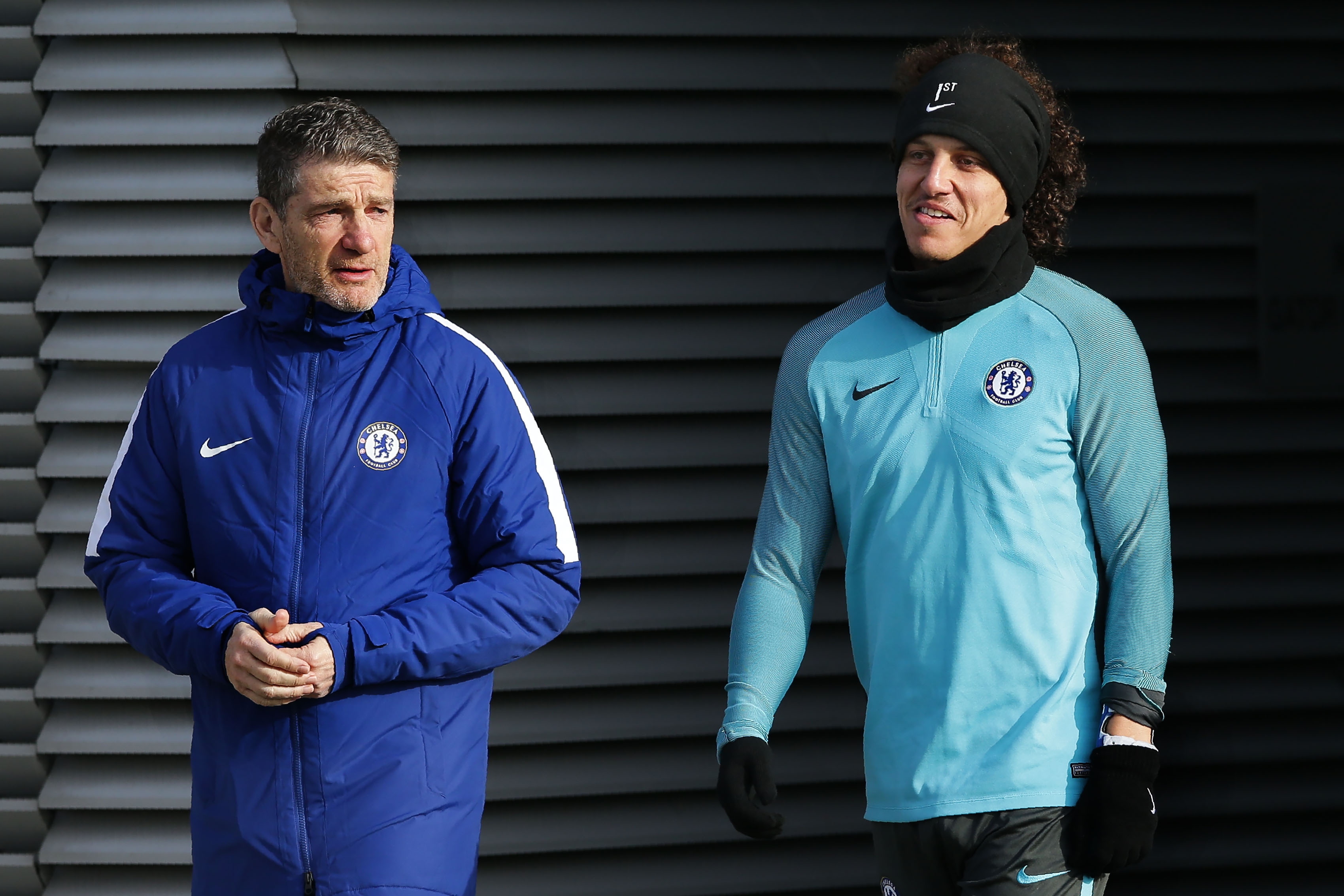 Chelsea's Brazilian defender David Luiz (R) arrives with a member of the coaching staff for a training session at Chelsea's Cobham training facility in Stoke D'Abernon, southwest of London on the eve of their UEFA Champions League Group C football against Roma on October 30, 2017. / AFP PHOTO / Daniel LEAL-OLIVAS        (Photo credit should read DANIEL LEAL-OLIVAS/AFP/Getty Images)