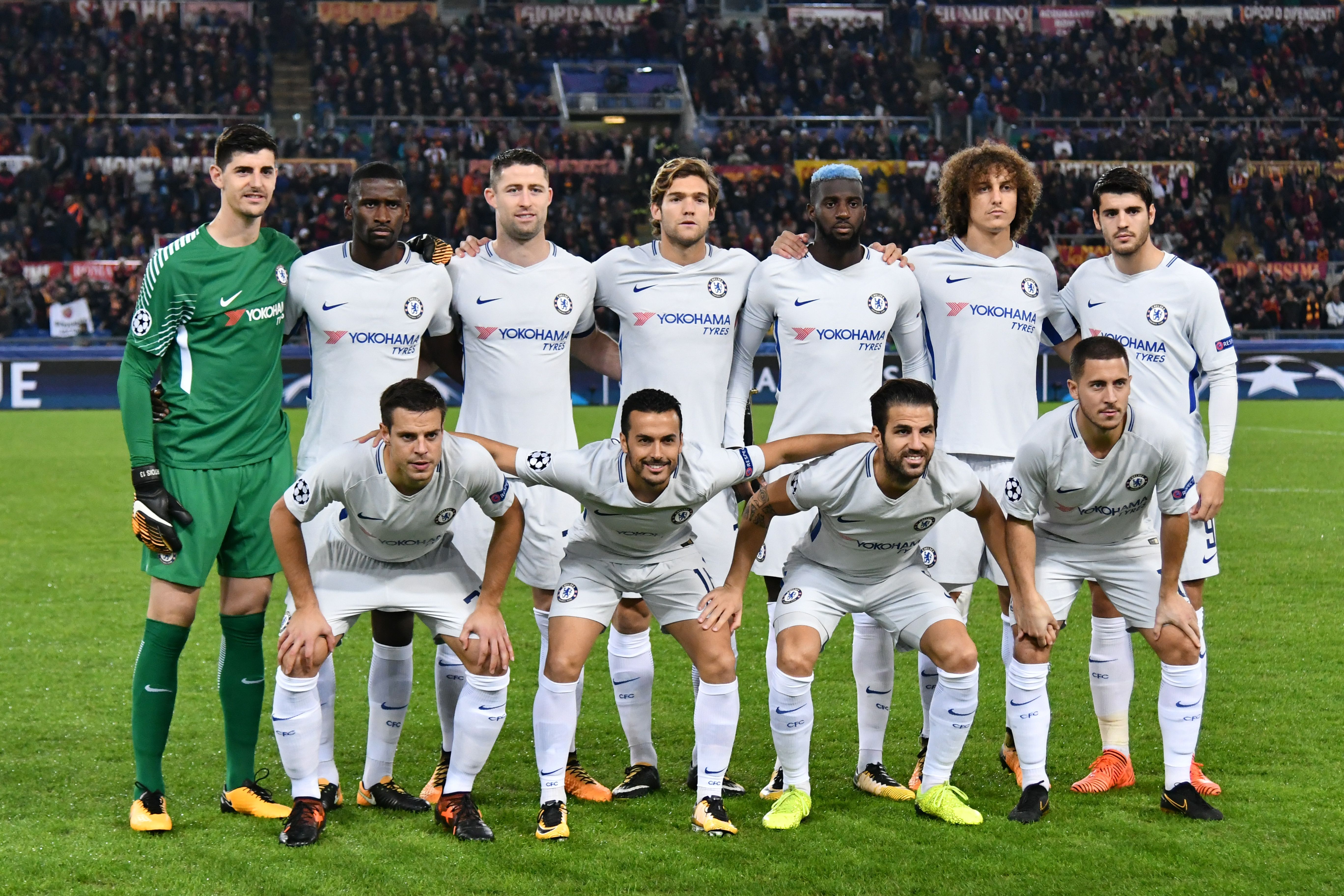 Chelsea's team players (from top left) Chelsea's Belgian goalkeeper Thibaut Courtois, Chelsea's German defender Antonio Rudiger, Chelsea's English defender Gary Cahill, Chelsea's Spanish defender Marcos Alonso, Chelsea's French midfielder Tiemoue Bakayoko, Chelsea's Brazilian defender David Luiz, Chelsea's Spanish striker Alvaro Morata, Chelsea's Spanish defender Cesar Azpilicueta, Chelsea's Spanish midfielder Pedro, Chelsea's Spanish midfielder Cesc Fabregas and Chelsea's Belgian midfielder Eden Hazard pose before the UEFA Champions League football match AS Roma vs Chelsea on October 31, 2017 at the Olympic Stadium in Rome. / AFP PHOTO / Alberto PIZZOLI (Photo credit should read ALBERTO PIZZOLI/AFP/Getty Images)