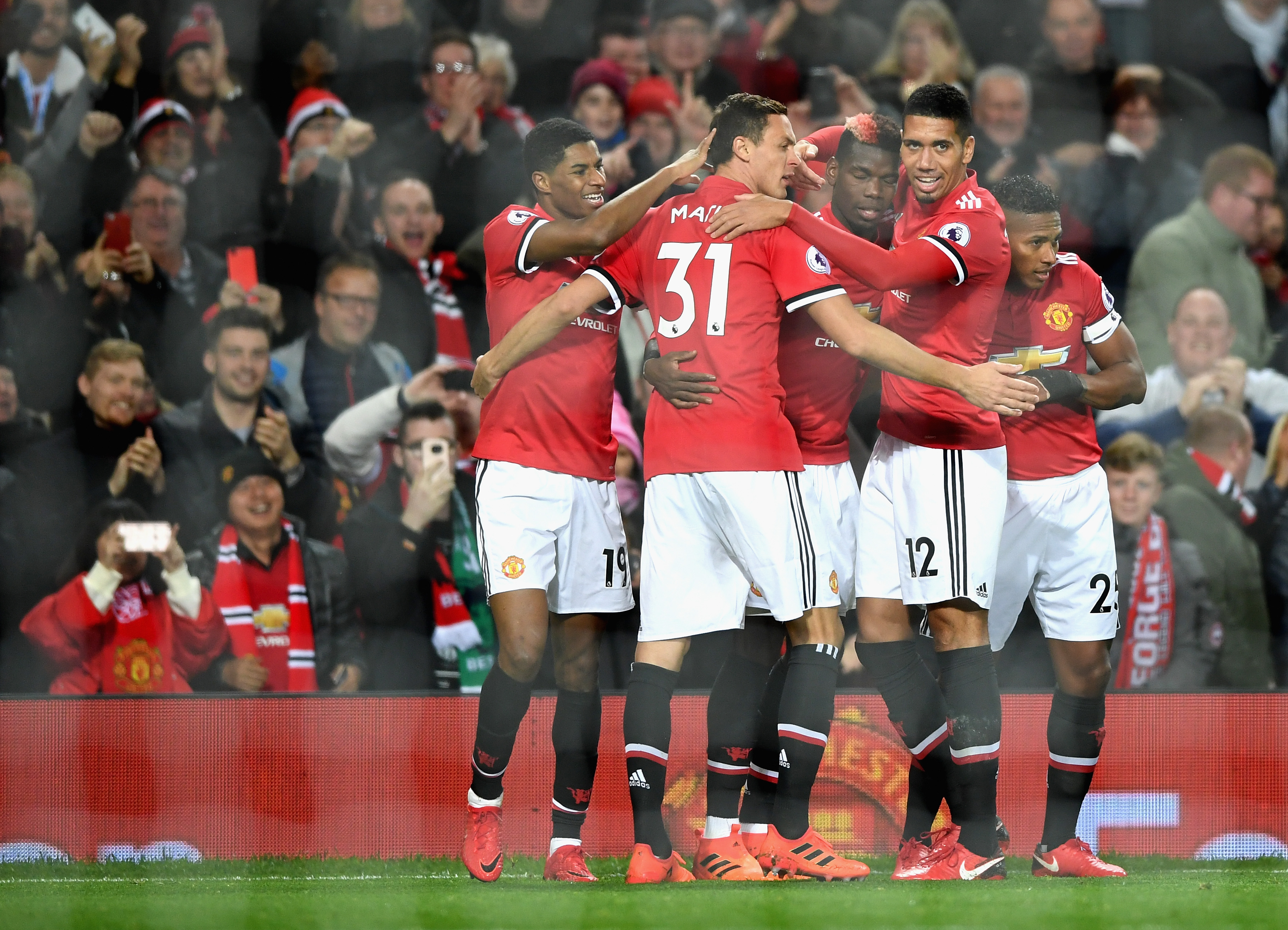 MANCHESTER, ENGLAND - NOVEMBER 18: Paul Pogba of Manchester United celebrates with team mates after scoring his sides third goal during the Premier League match between Manchester United and Newcastle United at Old Trafford on November 18, 2017 in Manchester, England. (Photo by Gareth Copley/Getty Images)