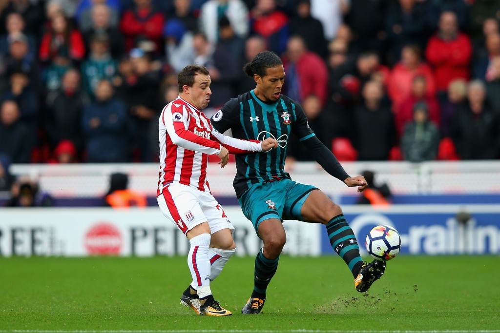 STOKE ON TRENT, ENGLAND - SEPTEMBER 30: Xherdan Shaqiri of Stoke City and Virgil van Dijk of Southampton compete for the ball during the Premier League match between Stoke City and Southampton at Bet365 Stadium on September 30, 2017 in Stoke on Trent, England. (Photo by Alex Livesey/Getty Images)