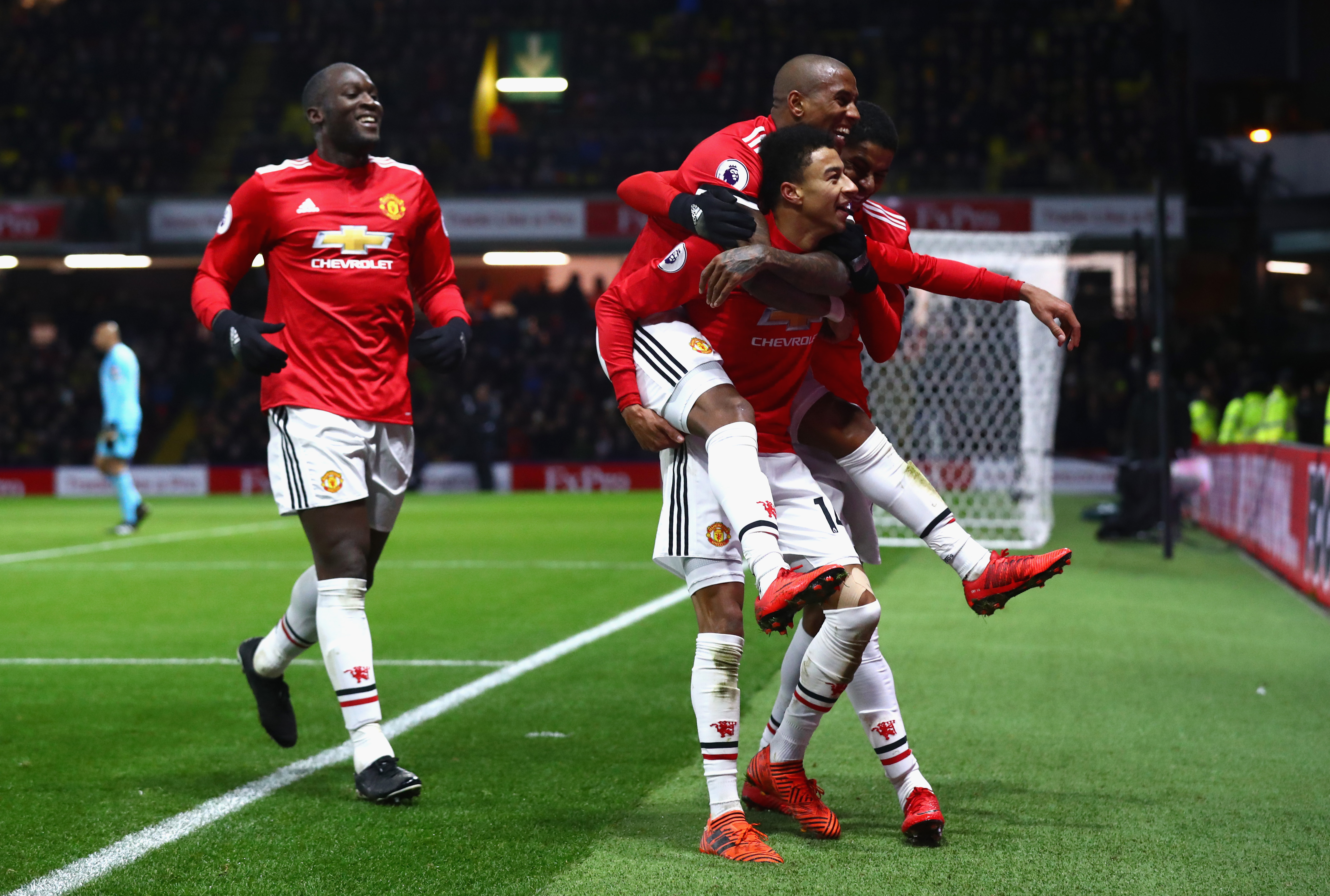 WATFORD, ENGLAND - NOVEMBER 28: Jesse Lingard of Manchester United celebrates as he scores their fourth goal with Ashley Young and Romelu Lukaku during the Premier League match between Watford and Manchester United at Vicarage Road on November 28, 2017 in Watford, England. (Photo by Clive Rose/Getty Images)
