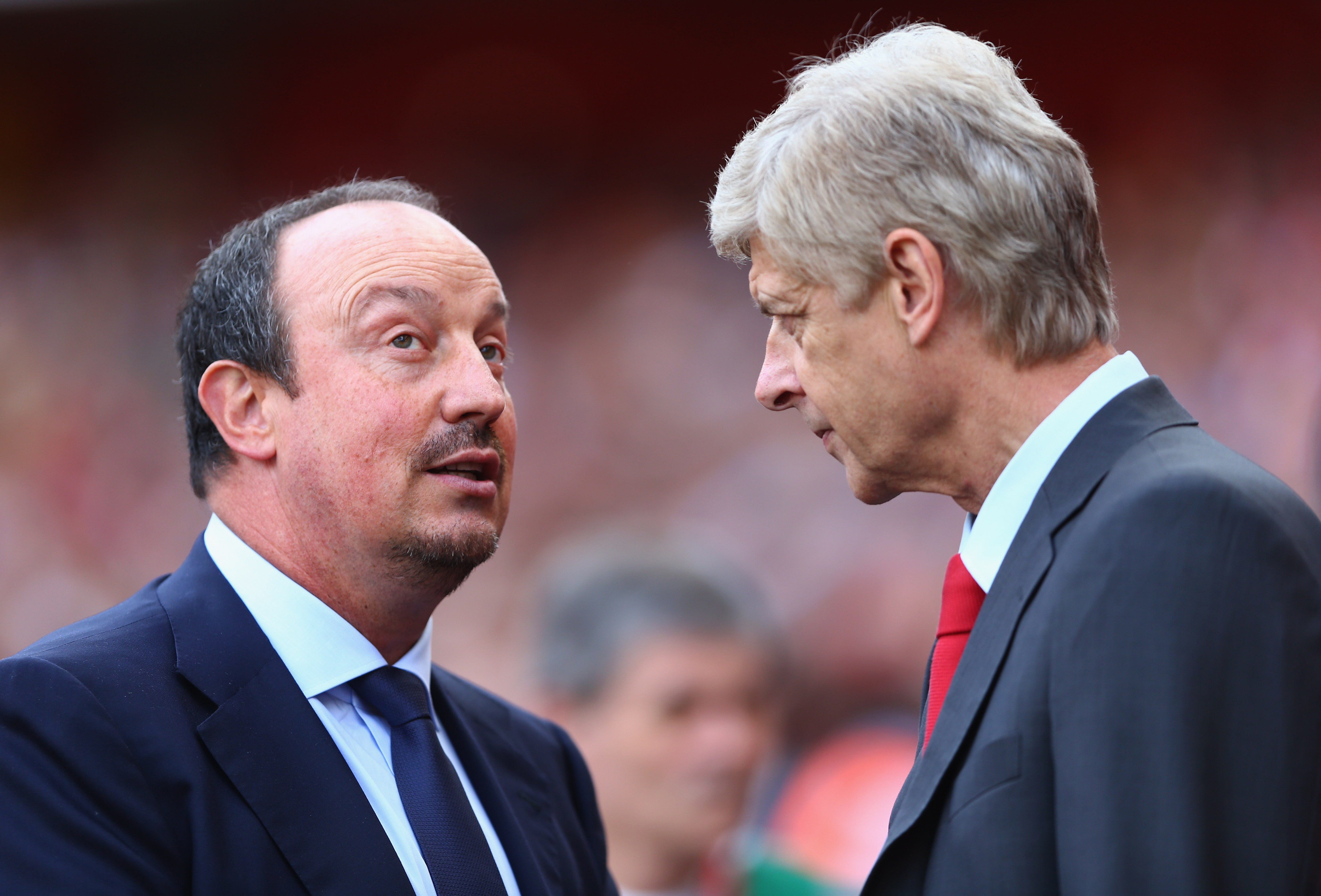 LONDON, ENGLAND - AUGUST 03: Manager Rafael Benitez of Napoli talks to manager Arsene Wenger of Arsenal during the match between Arsenal and Napoli at Emirates Stadium on August 3, 2013 in London, England. (Photo by Paul Gilham/Getty Images)