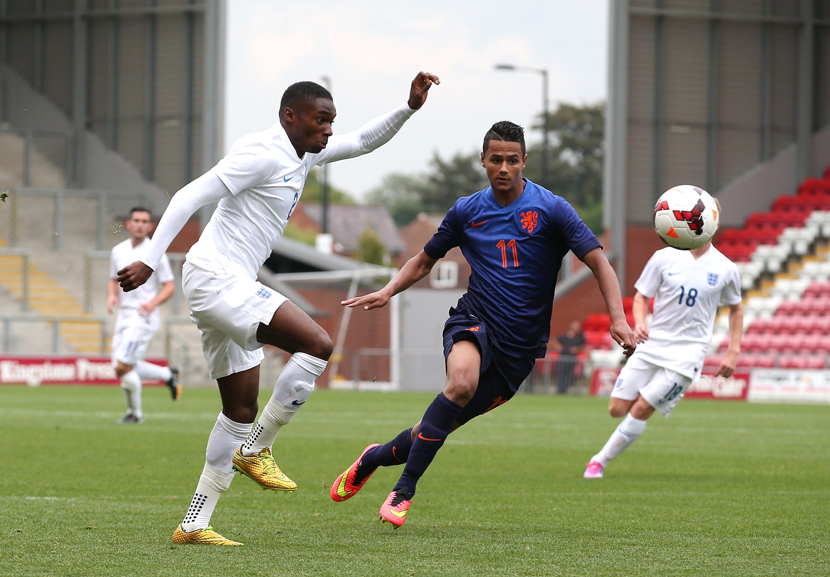 MANCHESTER, ENGLAND - SEPTEMBER 03:  Mandela Egbo of England U18 controls the ball from Alessio Da Cruz of Netherlands U18  during the U18 International Friendly match between England U18 and Netherlands U18 at Leigh Sports Village on September 3, 2014 in Leigh, Greater Manchester, England.  (Photo by Jan Kruger/Getty Images)
