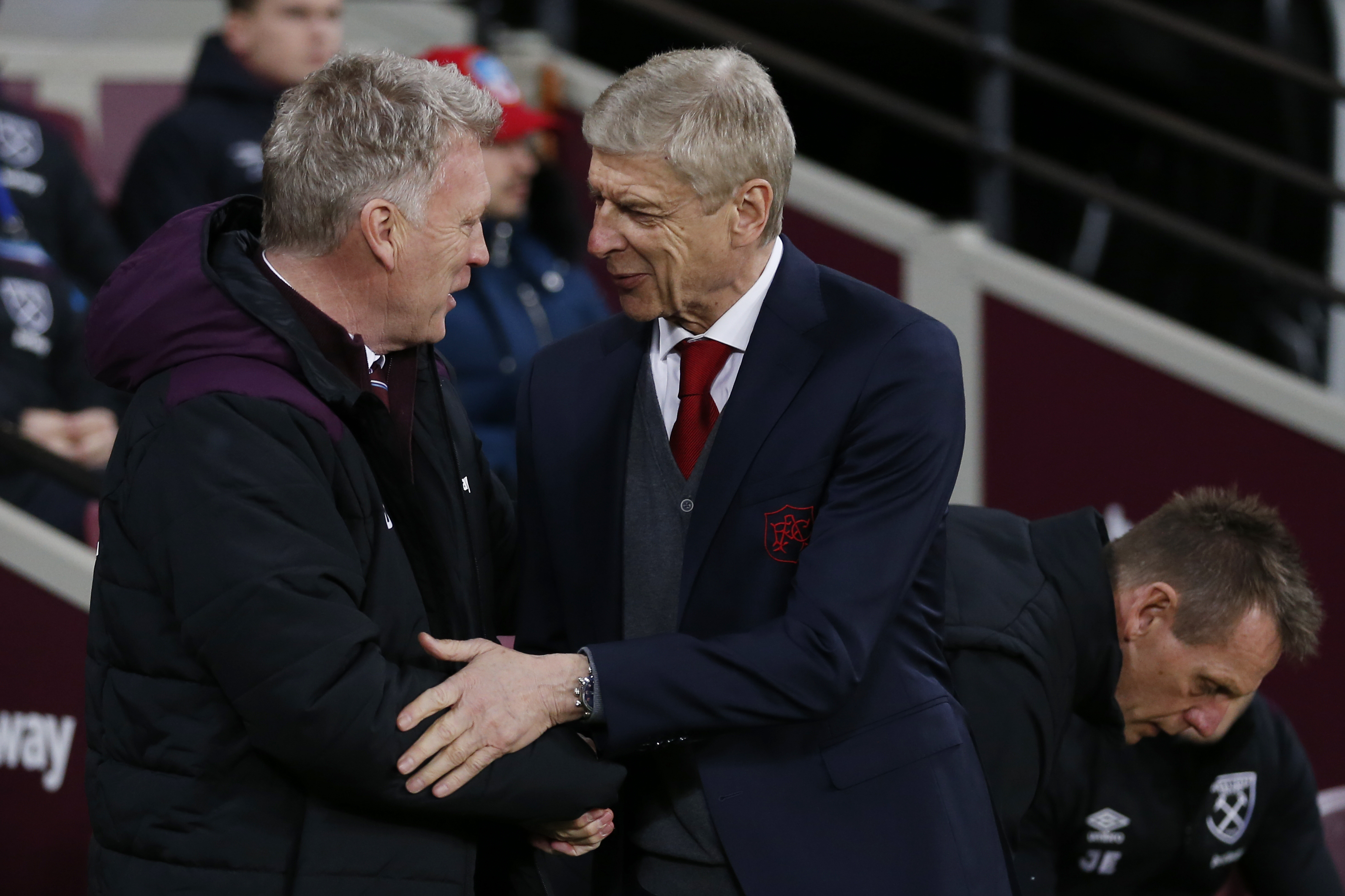 West Ham United's Scottish manager David Moyes (L) greets Arsenal's French manager Arsene Wenger before the English Premier League football match between West Ham United and Arsenal at The London Stadium, in east London on December 13, 2017. / AFP PHOTO / Ian KINGTON / RESTRICTED TO EDITORIAL USE. No use with unauthorized audio, video, data, fixture lists, club/league logos or 'live' services. Online in-match use limited to 75 images, no video emulation. No use in betting, games or single club/league/player publications. / (Photo credit should read IAN KINGTON/AFP/Getty Images)