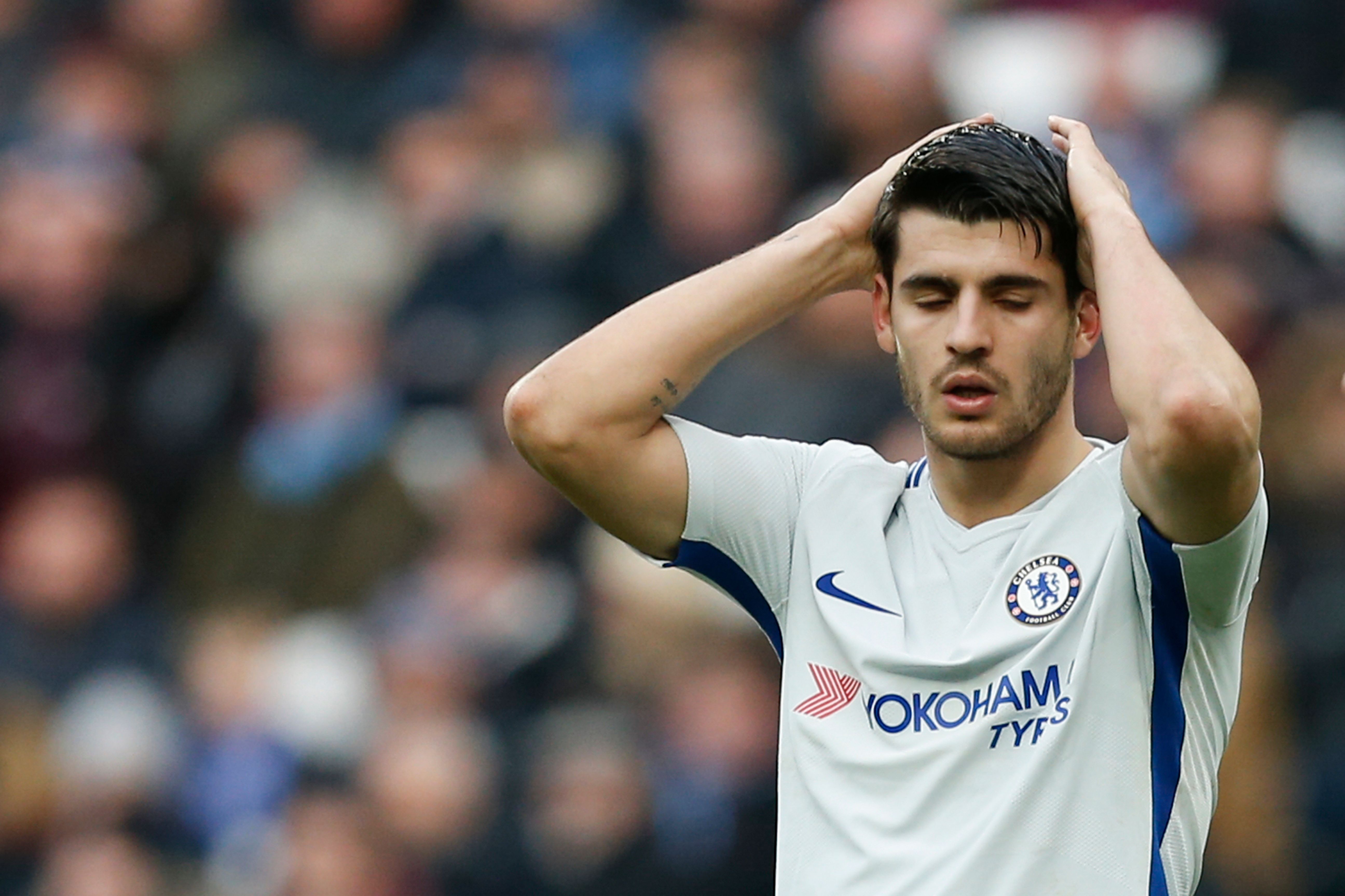 Chelsea's Spanish striker Alvaro Morata reacts after missing a good chance during the English Premier League football match between West Ham United and Chelsea at The London Stadium, in east London on December 9, 2017. / AFP PHOTO / Ian KINGTON / RESTRICTED TO EDITORIAL USE. No use with unauthorized audio, video, data, fixture lists, club/league logos or 'live' services. Online in-match use limited to 75 images, no video emulation. No use in betting, games or single club/league/player publications. /