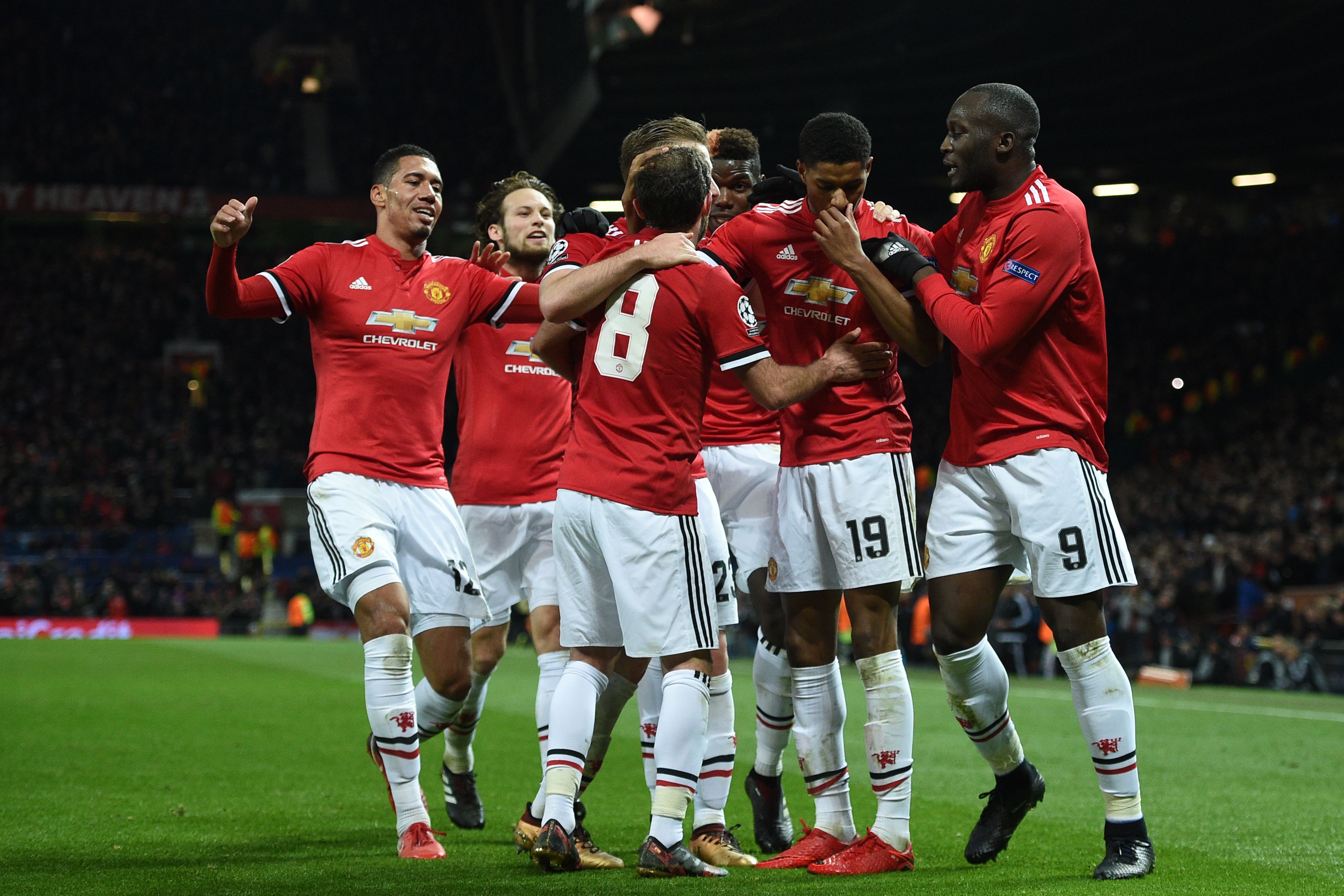 Manchester United's English striker Marcus Rashford (2nd R) celebrates with teammates after scoring their second goal during the UEFA Champions League Group A football match between Manchester United and CSKA Moscow at Old Trafford in Manchester, north west England on December 5, 2017. / AFP PHOTO / Oli SCARFF (Photo credit should read OLI SCARFF/AFP/Getty Images)