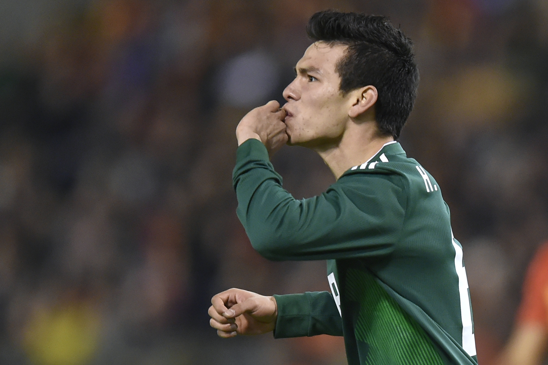 Mexico's forward Hirving Lozano celebrates after scoring a goal during the international friendly football match between Belgium and Mexico at the King Baudouin Stadium in Brussels on November 10, 2017. / AFP PHOTO / JOHN THYS (Photo credit should read JOHN THYS/AFP/Getty Images)