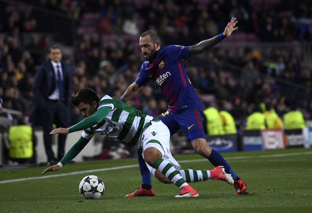 BARCELONA, SPAIN - DECEMBER 05: Marcos Acuna of Sporting Lisbon is challenged by Aleix Vidal of Barcelona during the UEFA Champions League group D match between FC Barcelona and Sporting CP at Camp Nou on December 5, 2017 in Barcelona, Spain. (Photo by Alex Caparros/Getty Images)