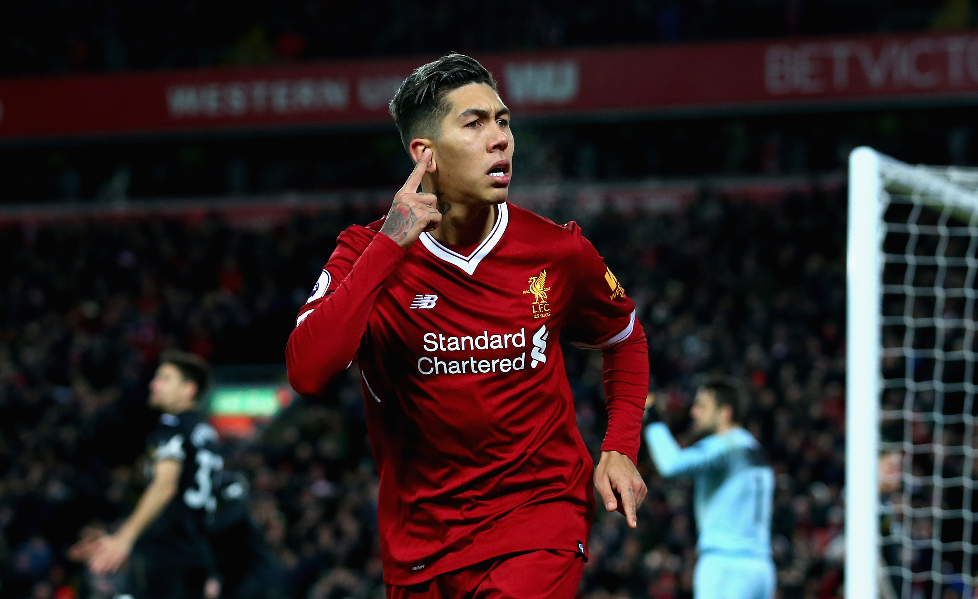 LIVERPOOL, ENGLAND - DECEMBER 26: Roberto Firmino of Liverpool celebrates after scoring his sides second goal during the Premier League match between Liverpool and Swansea City at Anfield on December 26, 2017 in Liverpool, England. (Photo by Jan Kruger/Getty Images)