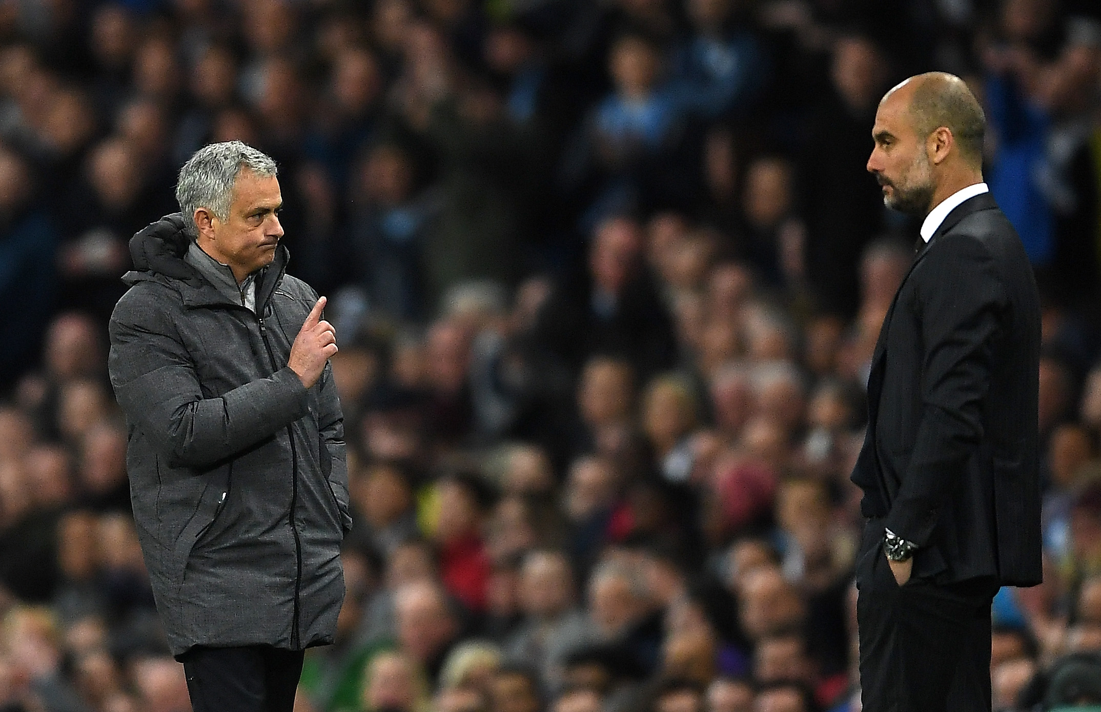 MANCHESTER, ENGLAND - APRIL 27: Jose Mourinho, Manager of Manchester United (L) and Josep Guardiola, Manager of Manchester City (R) during the Premier League match between Manchester City and Manchester United at Etihad Stadium on April 27, 2017 in Manchester, England. (Photo by Laurence Griffiths/Getty Images)