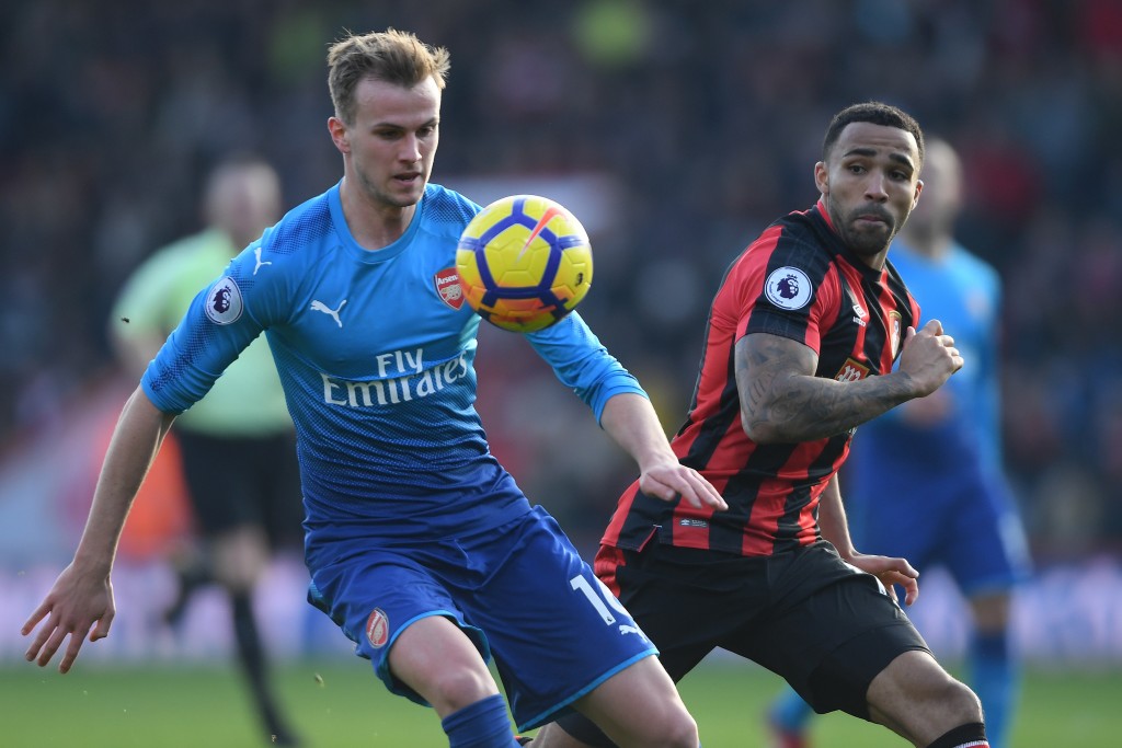 BOURNEMOUTH, ENGLAND - JANUARY 14: Rob Holding of Arsenal is challenged by Callum Wilson of Bournemouth during the Premier League match between AFC Bournemouth and Arsenal at Vitality Stadium on January 14, 2018 in Bournemouth, England. (Photo by Mike Hewitt/Getty Images)