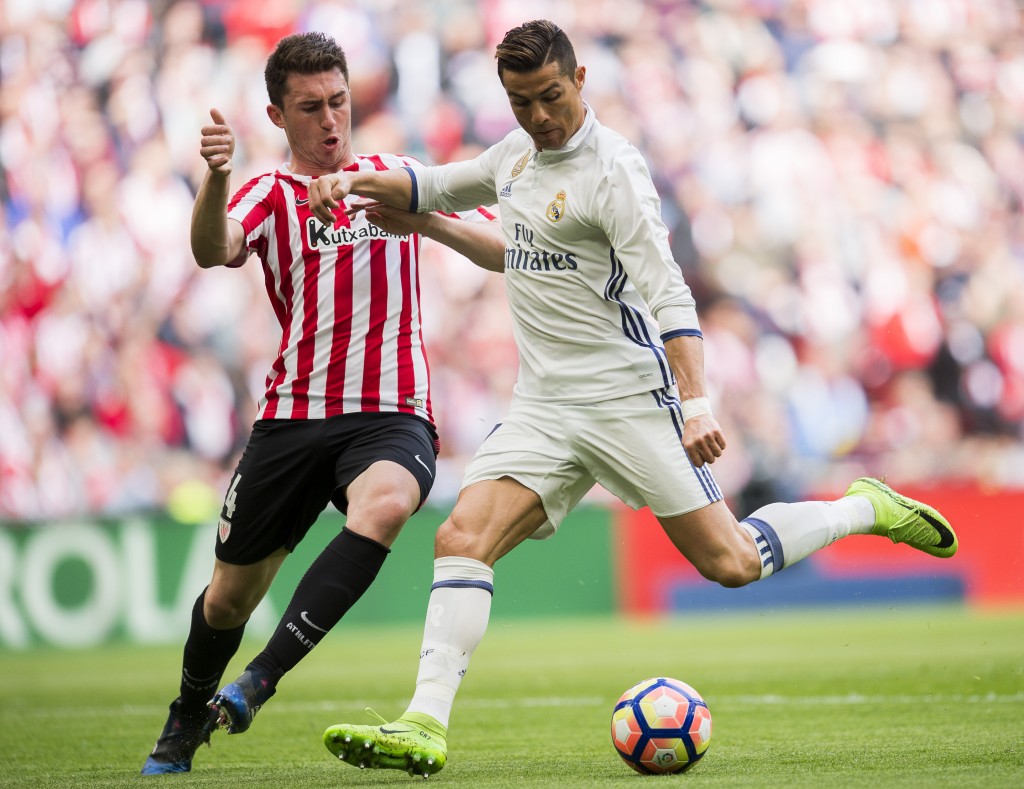 BILBAO, SPAIN - MARCH 18: Cristiano Ronaldo of Real Madrid competes for the ball with Aymeric Laporte of Athletic Club during the La Liga match between Athletic Club Bilbao and Real Madrid at San Mames Stadium on on March 18, 2017 in Bilbao, Spain. (Photo by Juan Manuel Serrano Arce/Getty Images)