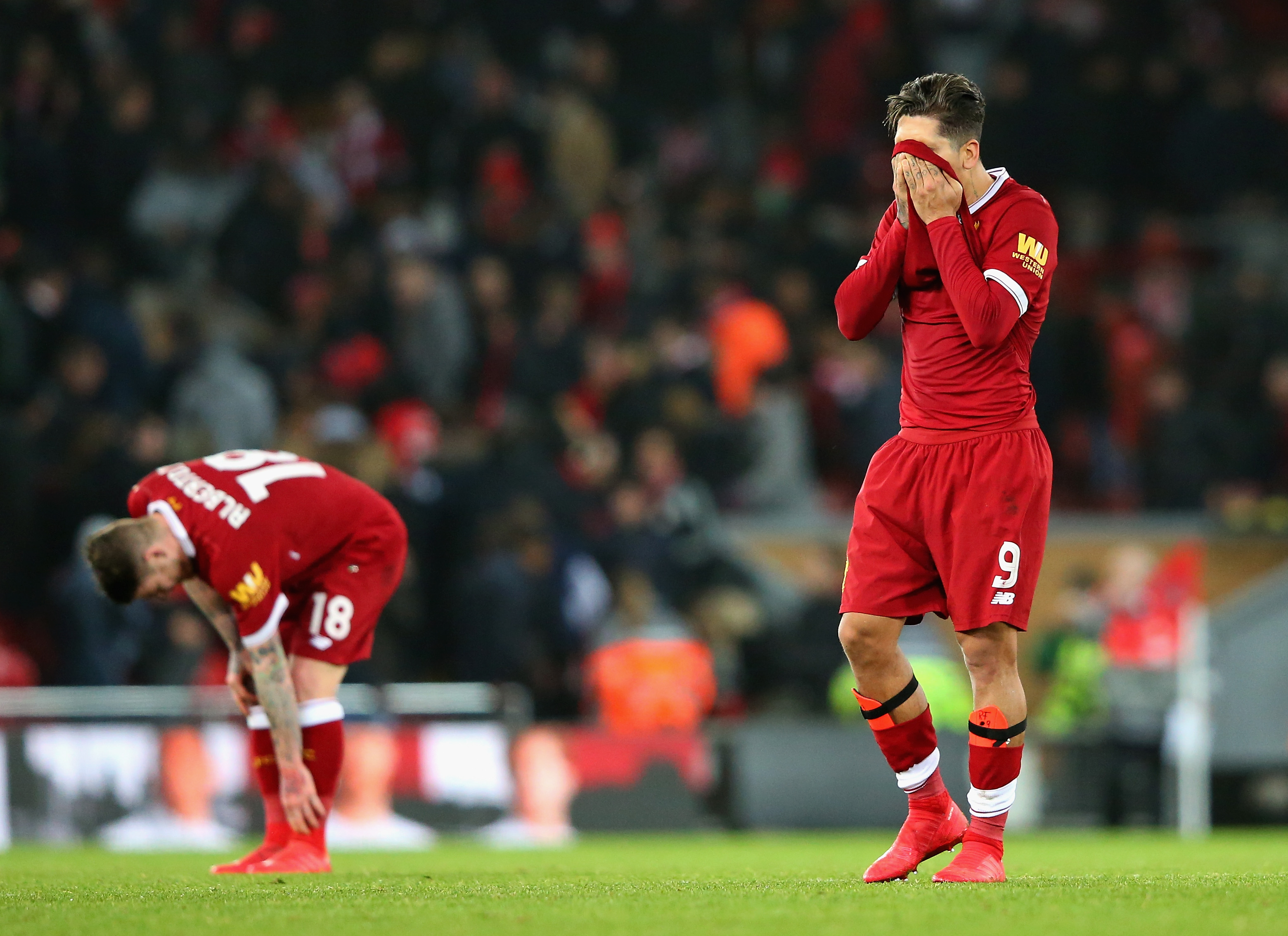 LIVERPOOL, ENGLAND - JANUARY 27: Roberto Firmino of Liverpool looks dejected following defeat during The Emirates FA Cup Fourth Round match between Liverpool and West Bromwich Albion at Anfield on January 27, 2018 in Liverpool, England. (Photo by Alex Livesey/Getty Images)