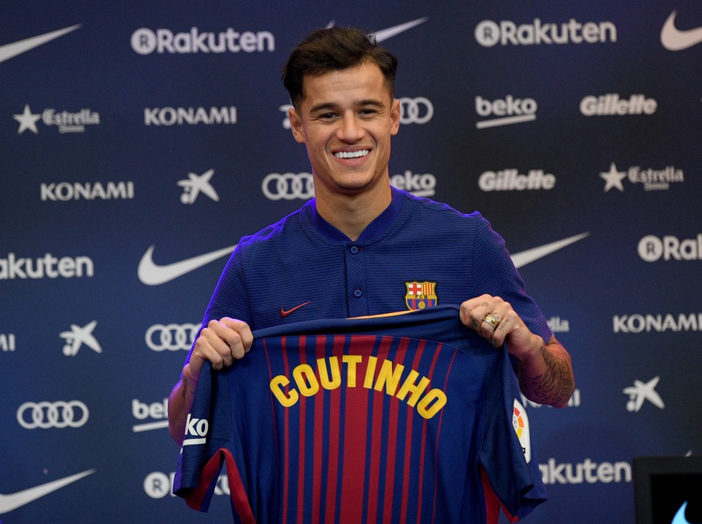 BARCELONA, SPAIN - JANUARY 08: New Barcelona signing Philippe Coutinho poses for a photograph with his new shirt as he is unveiled at Camp Nou on January 8, 2018 in Barcelona, Spain. The Brazilian player signed from Liverpool, has agreed a deal with the Catalan club until 2023 season. (Photo by David Ramos/Getty Images)
