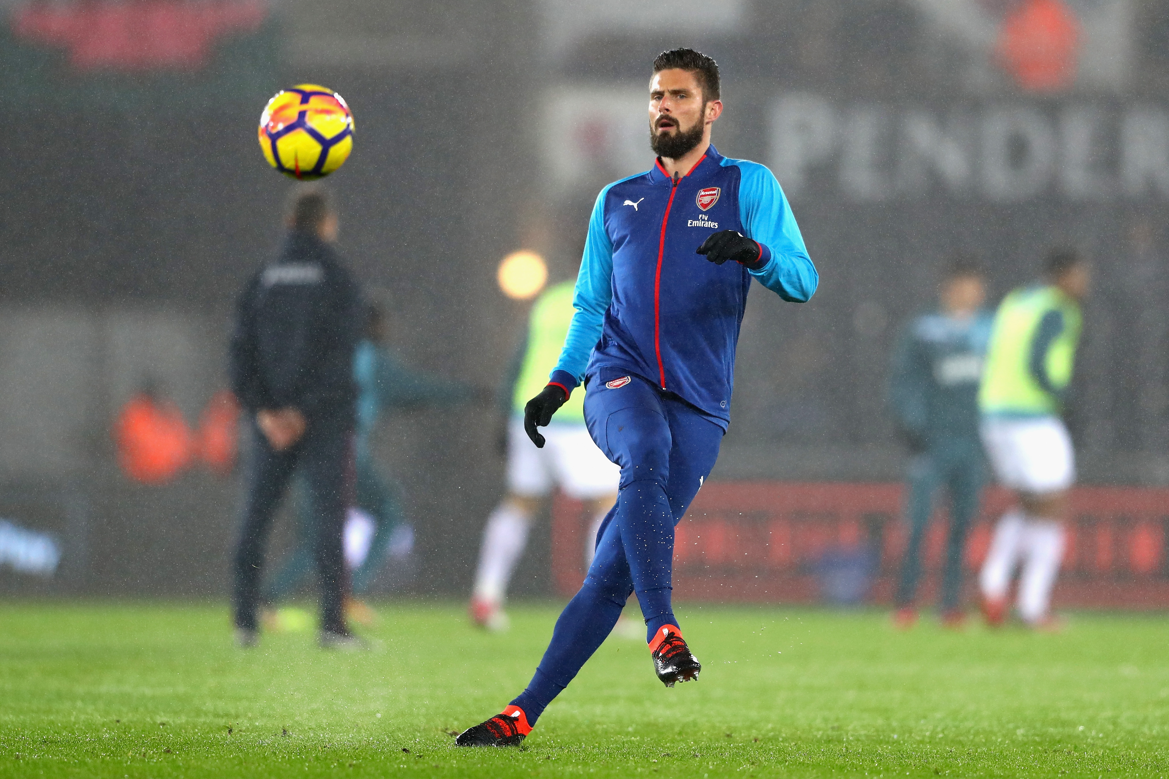 SWANSEA, WALES - JANUARY 30: Olivier Giroud of Arsenal warms up prior to the Premier League match between Swansea City and Arsenal at Liberty Stadium on January 30, 2018 in Swansea, Wales. (Photo by Michael Steele/Getty Images)