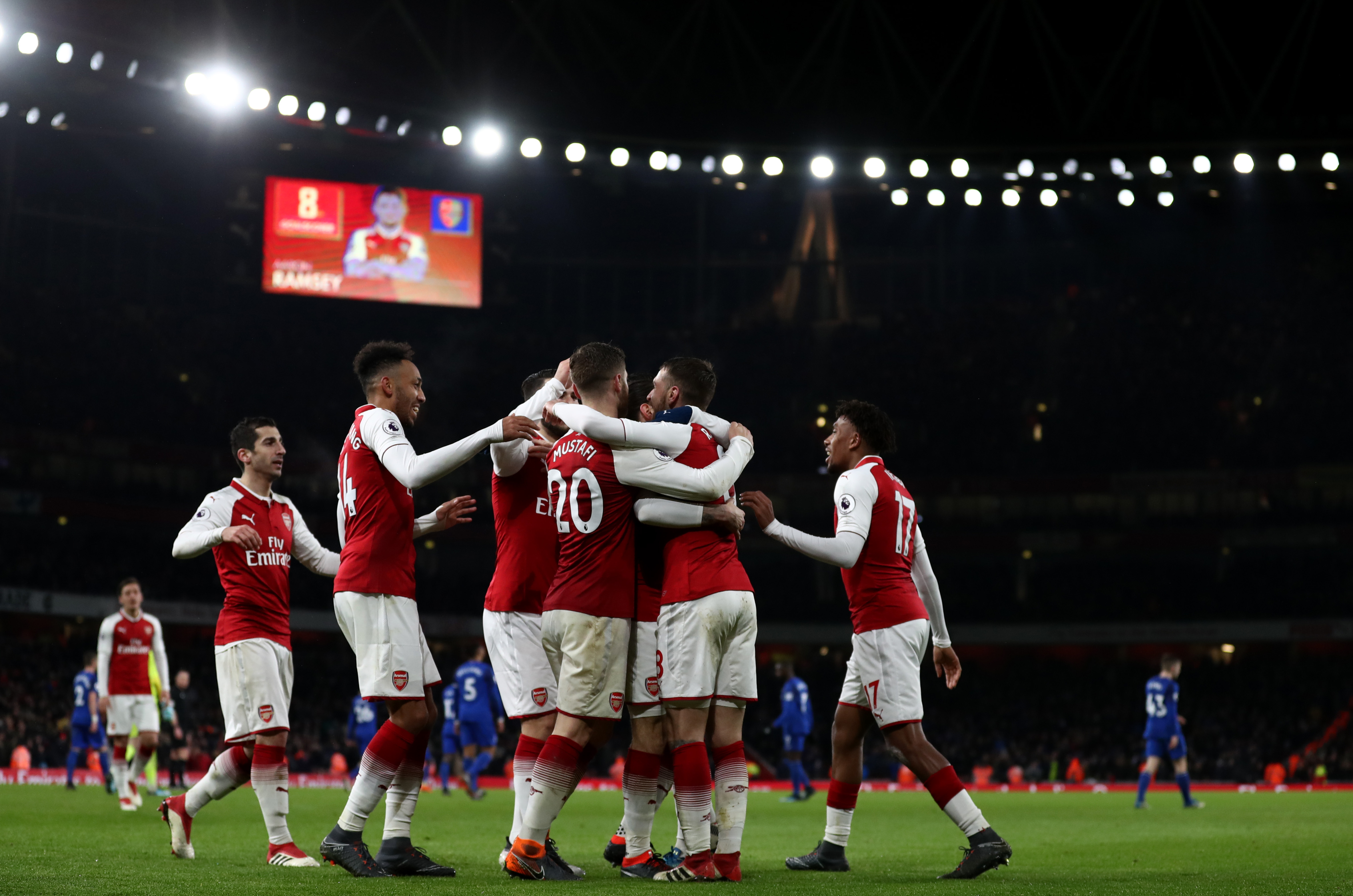 LONDON, ENGLAND - FEBRUARY 03: Aaron Ramsey of Arsenal celebrates after scoring his sides fifth goal and his hat-trick with his team mates during the Premier League match between Arsenal and Everton at Emirates Stadium on February 3, 2018 in London, England. (Photo by Catherine Ivill/Getty Images)