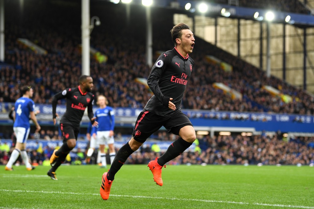 LIVERPOOL, ENGLAND - OCTOBER 22: Mesut Ozil of Arsenal scores his sides second goal during the Premier League match between Everton and Arsenal at Goodison Park on October 22, 2017 in Liverpool, England. (Photo by Gareth Copley/Getty Images)