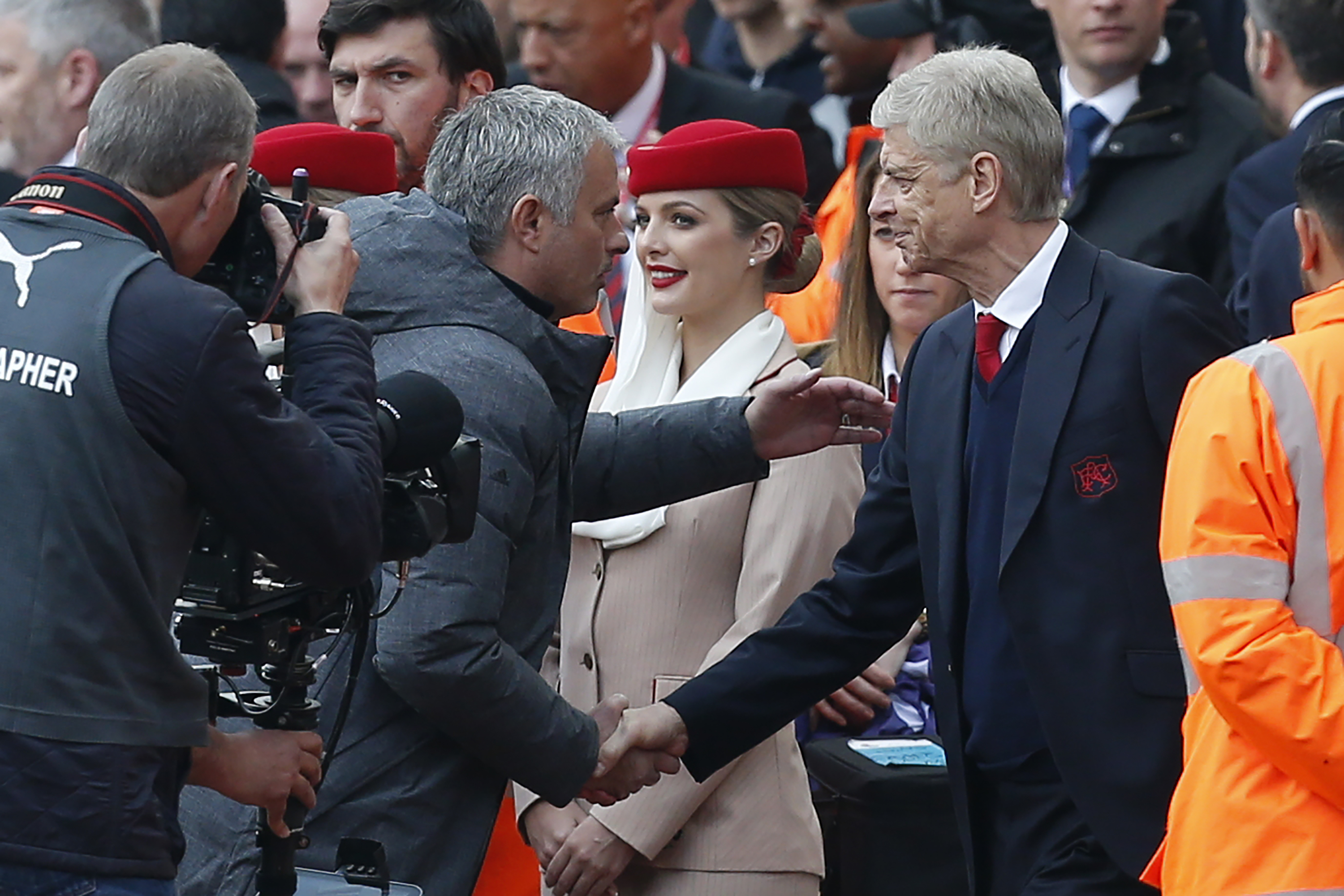 Arsenal's French manager Arsene Wenger (R) shakes hands with Manchester United's Portuguese manager Jose Mourinho ahead of the English Premier League football match between Arsenal and Manchester United at the Emirates Stadium in London on May 7, 2017. / AFP PHOTO / IKIMAGES / Ian KINGTON / RESTRICTED TO EDITORIAL USE. No use with unauthorized audio, video, data, fixture lists, club/league logos or 'live' services. Online in-match use limited to 45 images, no video emulation. No use in betting, games or single club/league/player publications. / (Photo credit should read IAN KINGTON/AFP/Getty Images)