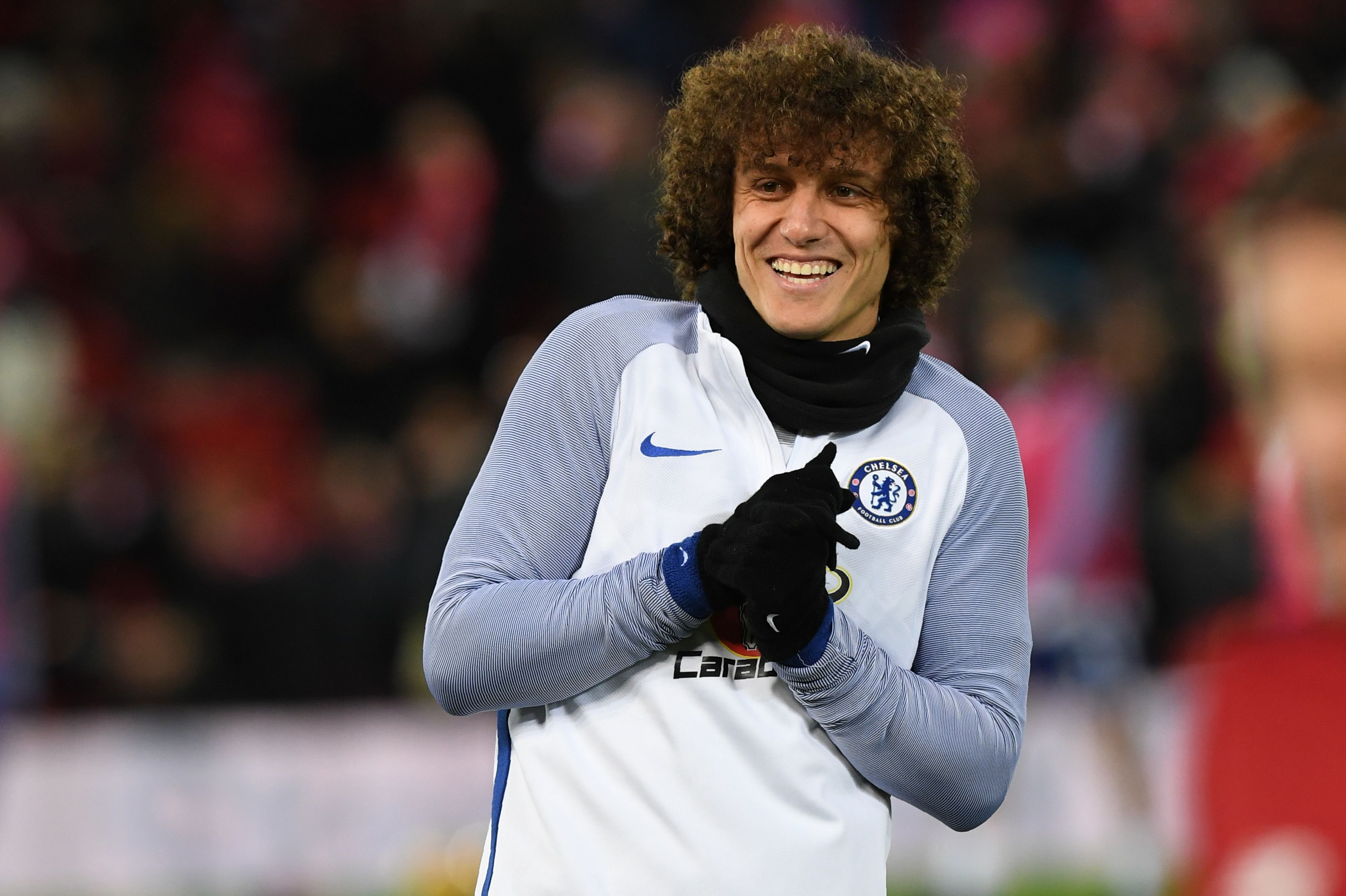 Chelsea's Brazilian defender David Luiz warms up on the pitch ahead of the English Premier League football match between Liverpool and Chelsea at Anfield in Liverpool, north west England on November 25, 2017. / AFP PHOTO / Paul ELLIS / RESTRICTED TO EDITORIAL USE. No use with unauthorized audio, video, data, fixture lists, club/league logos or 'live' services. Online in-match use limited to 75 images, no video emulation. No use in betting, games or single club/league/player publications. / (Photo credit should read PAUL ELLIS/AFP/Getty Images)