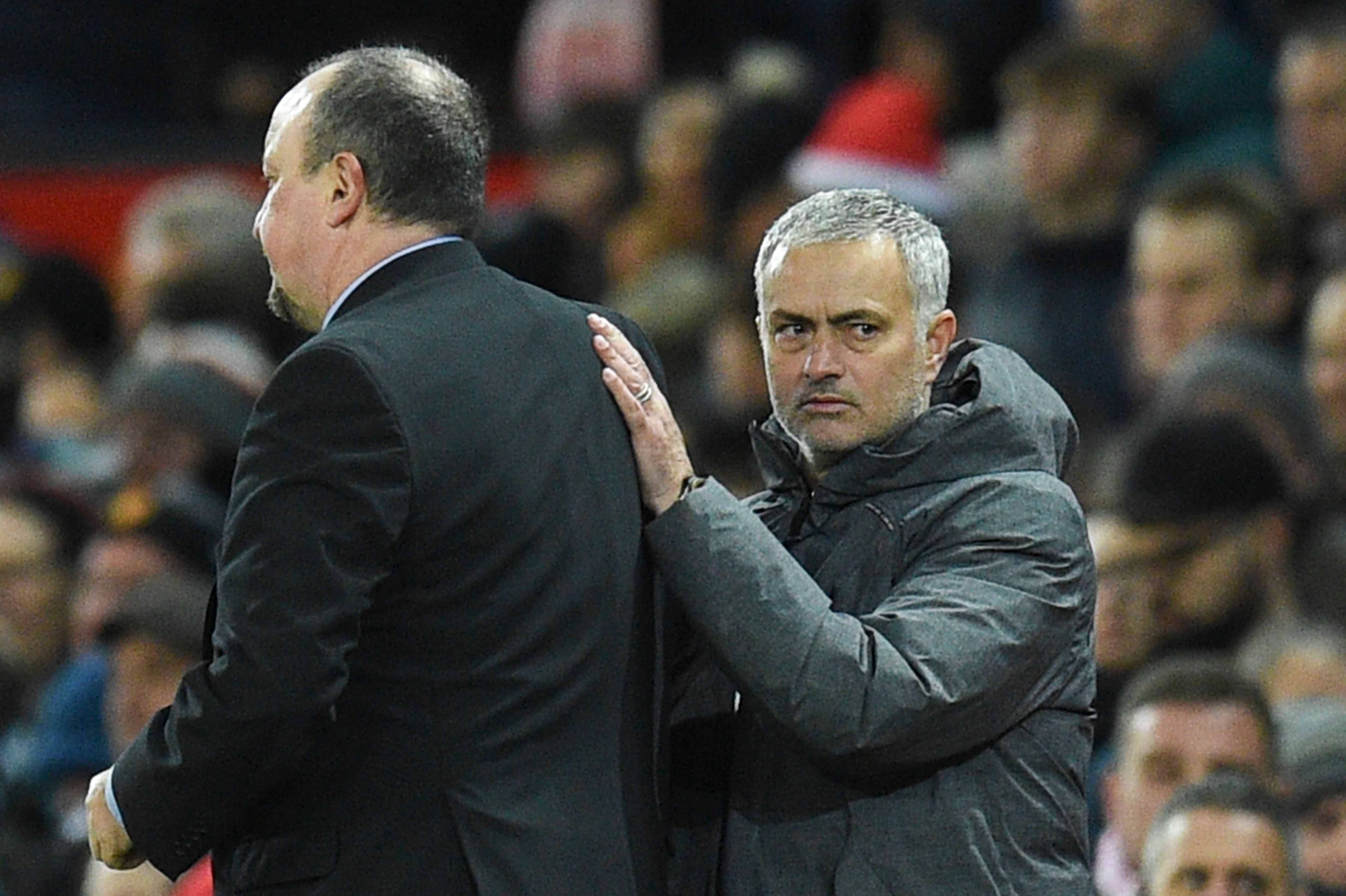 Manchester United's Portuguese manager Jose Mourinho (R) shakes hands with Newcastle United's Spanish manager Rafael Benitez (L) at the end of the English Premier League football match between Manchester United and Newcastle at Old Trafford in Manchester, north west England, on November 18, 2017. / AFP PHOTO / Oli SCARFF / RESTRICTED TO EDITORIAL USE. No use with unauthorized audio, video, data, fixture lists, club/league logos or 'live' services. Online in-match use limited to 75 images, no video emulation. No use in betting, games or single club/league/player publications. / (Photo credit should read OLI SCARFF/AFP/Getty Images)